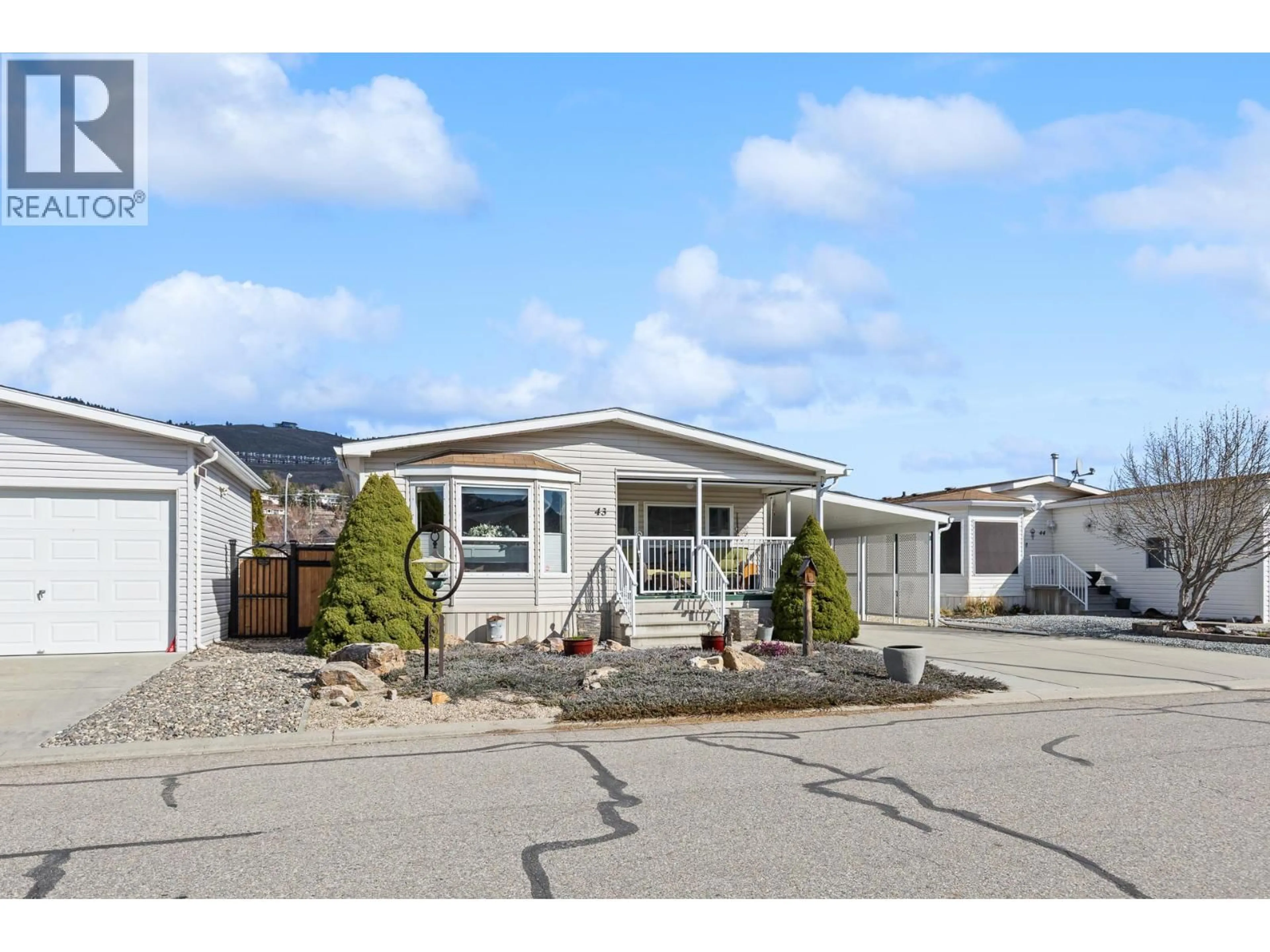 Home with vinyl exterior material, street for 43 - 6688 TRONSON ROAD, Vernon British Columbia V1H1R9
