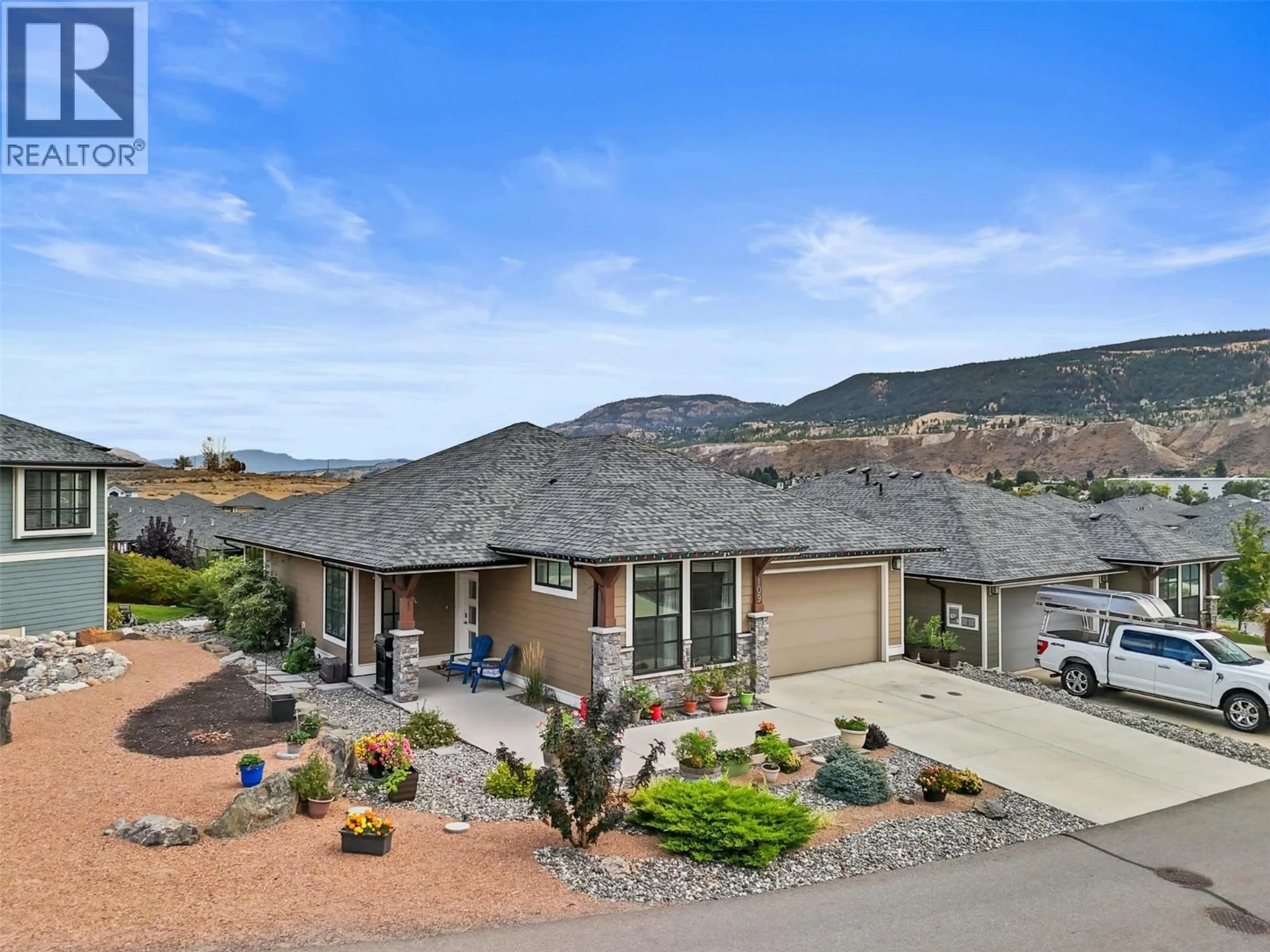 A pic from outside/outdoor area/front of a property/back of a property/a pic from drone, mountain view for 109 - 641 SHUSWAP ROAD EAST, Kamloops British Columbia V2H0E2