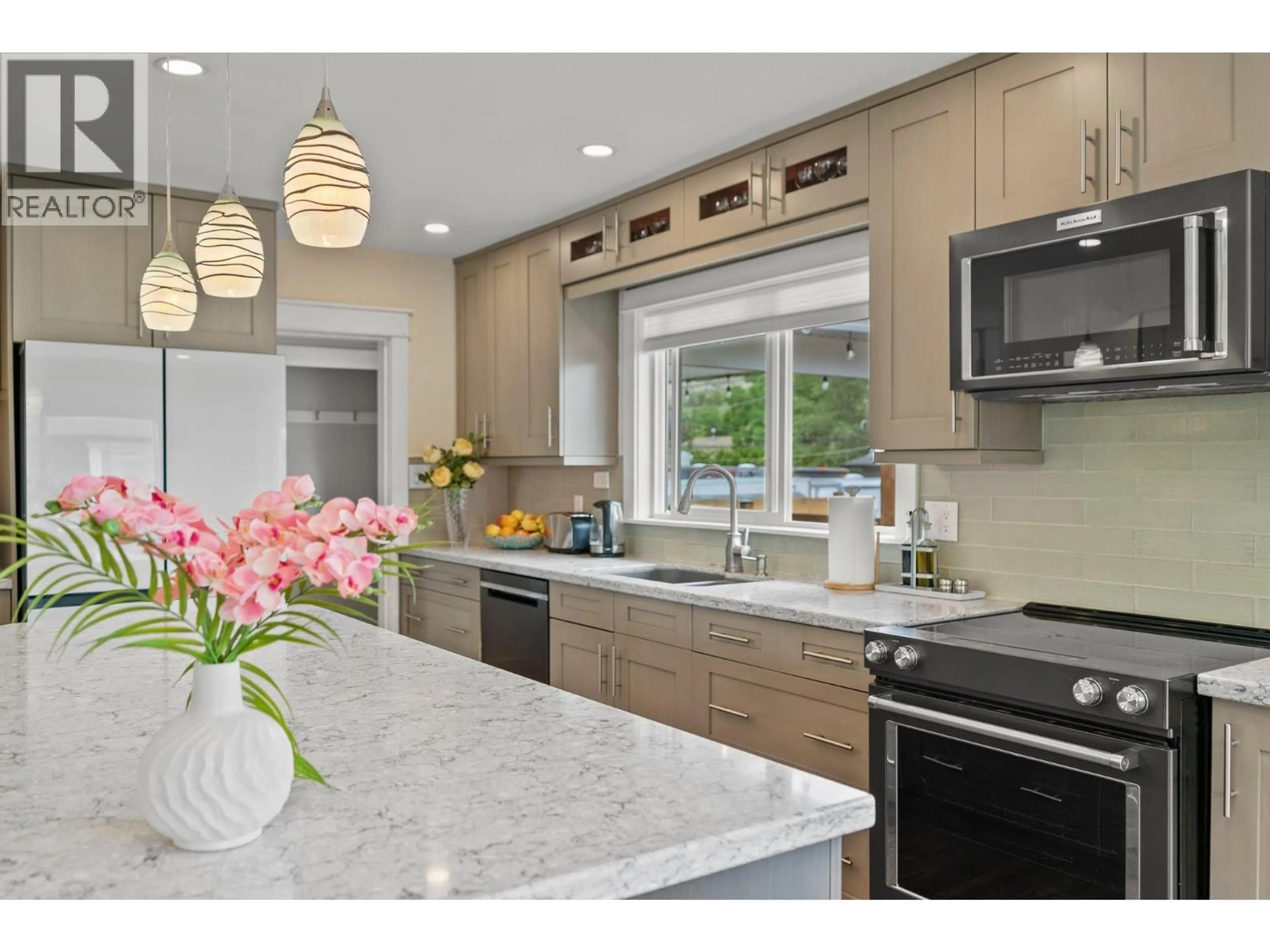 Contemporary kitchen, ceramic/tile floor for 845 RICHTER STREET, Kelowna British Columbia V1Y2J9