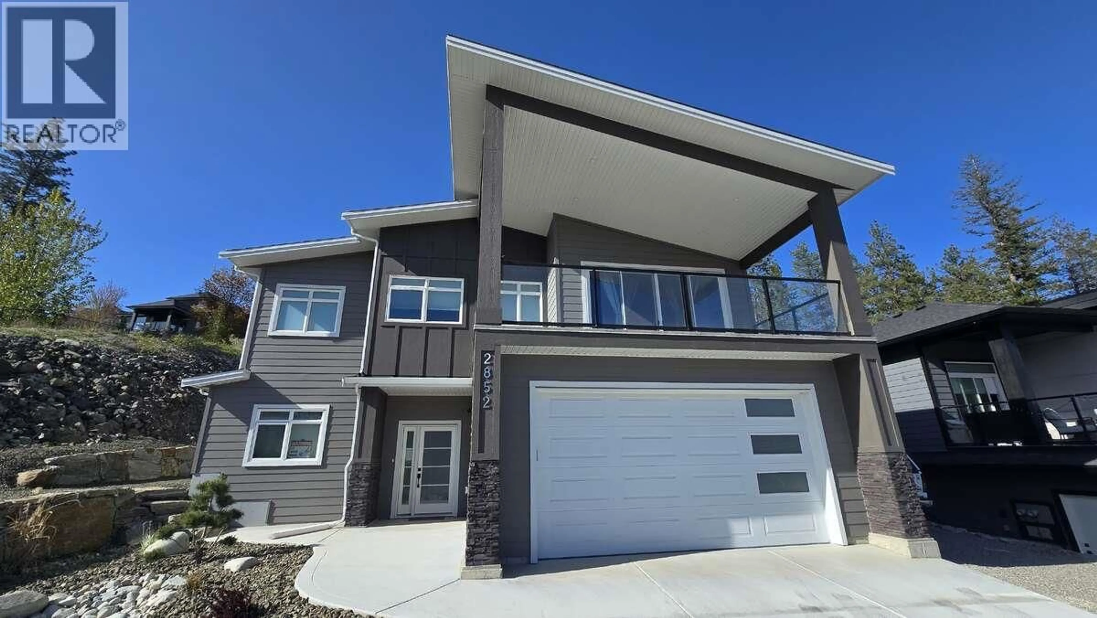 Home with vinyl exterior material, street for 2852 CANYON CREST DRIVE, West Kelowna British Columbia V4T3A6