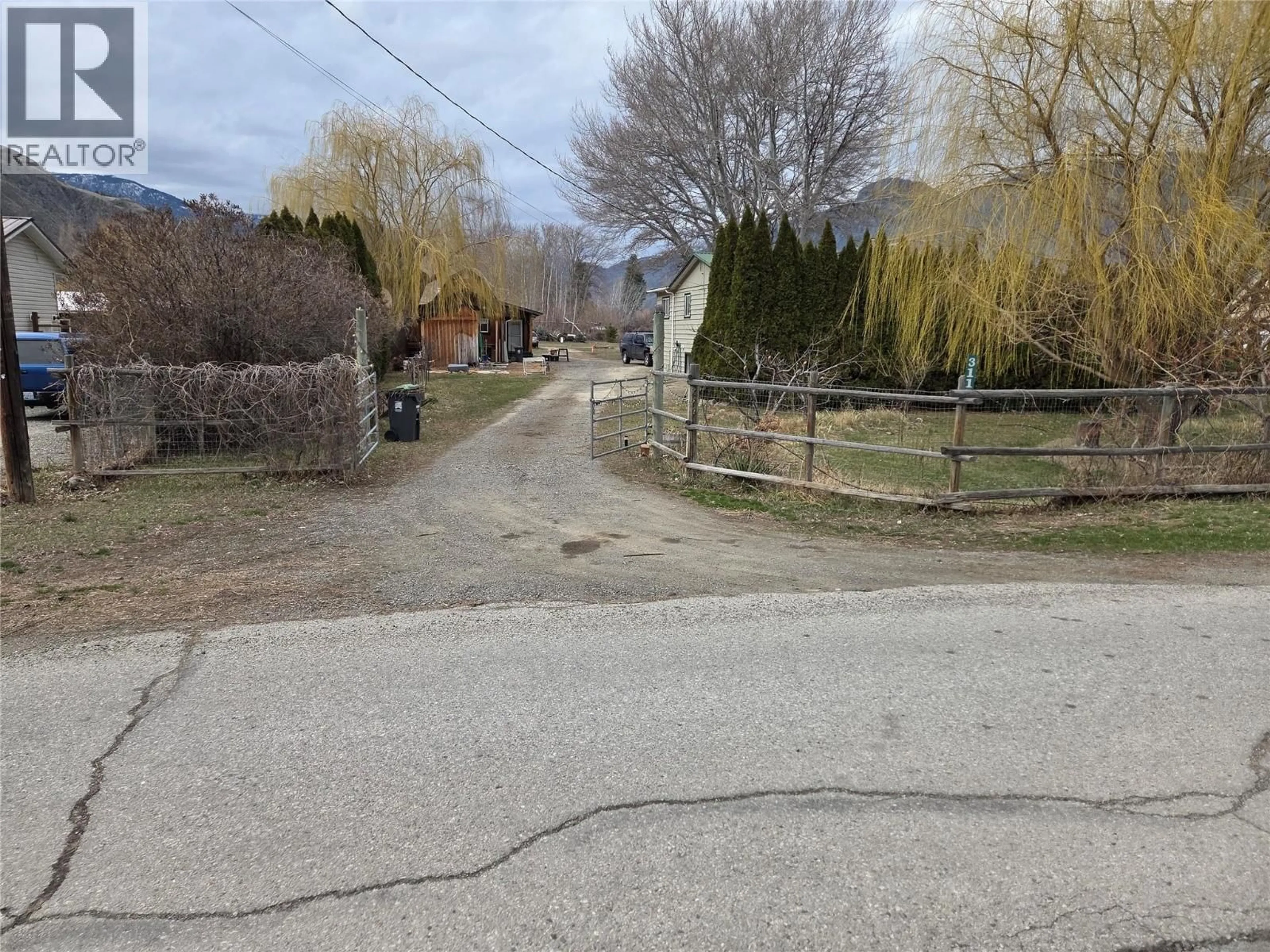 A pic from outside/outdoor area/front of a property/back of a property/a pic from drone, street for 311 COULTHARD ROAD, Cawston British Columbia V0X1C1