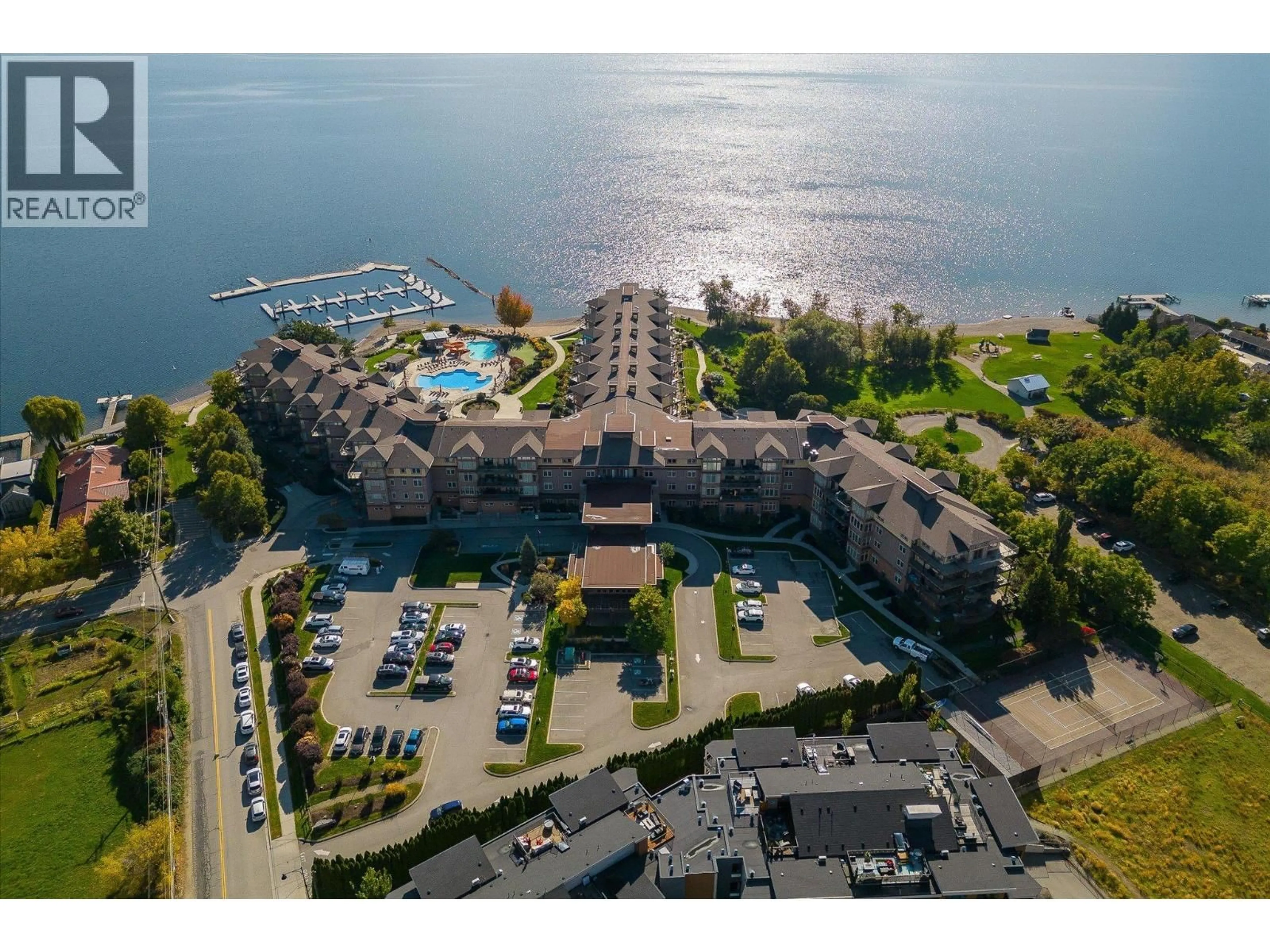 A pic from outside/outdoor area/front of a property/back of a property/a pic from drone, water/lake/river/ocean view for 305 - 4205 GELLATLY ROAD, West Kelowna British Columbia V4T2K2