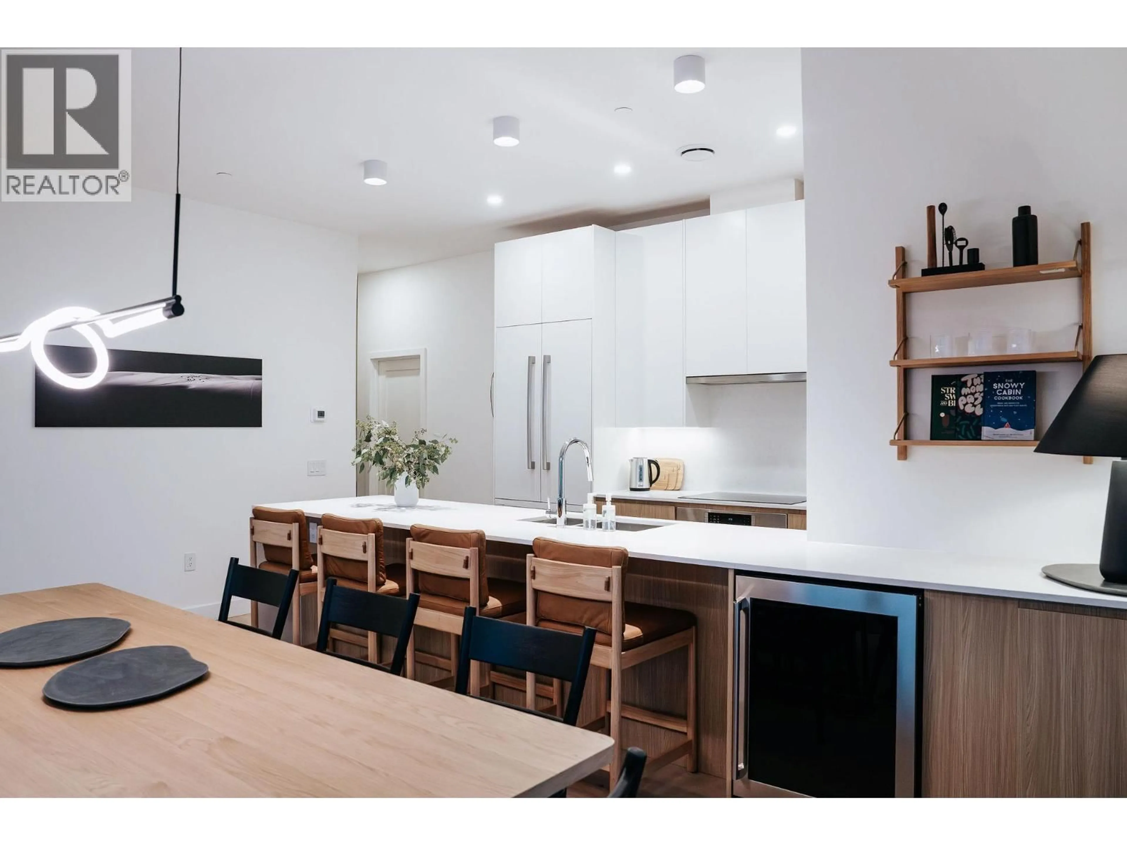 Open concept kitchen, wood/laminate floor for 2501 - 1702 COURSIER AVENUE, Revelstoke British Columbia V0E2S1