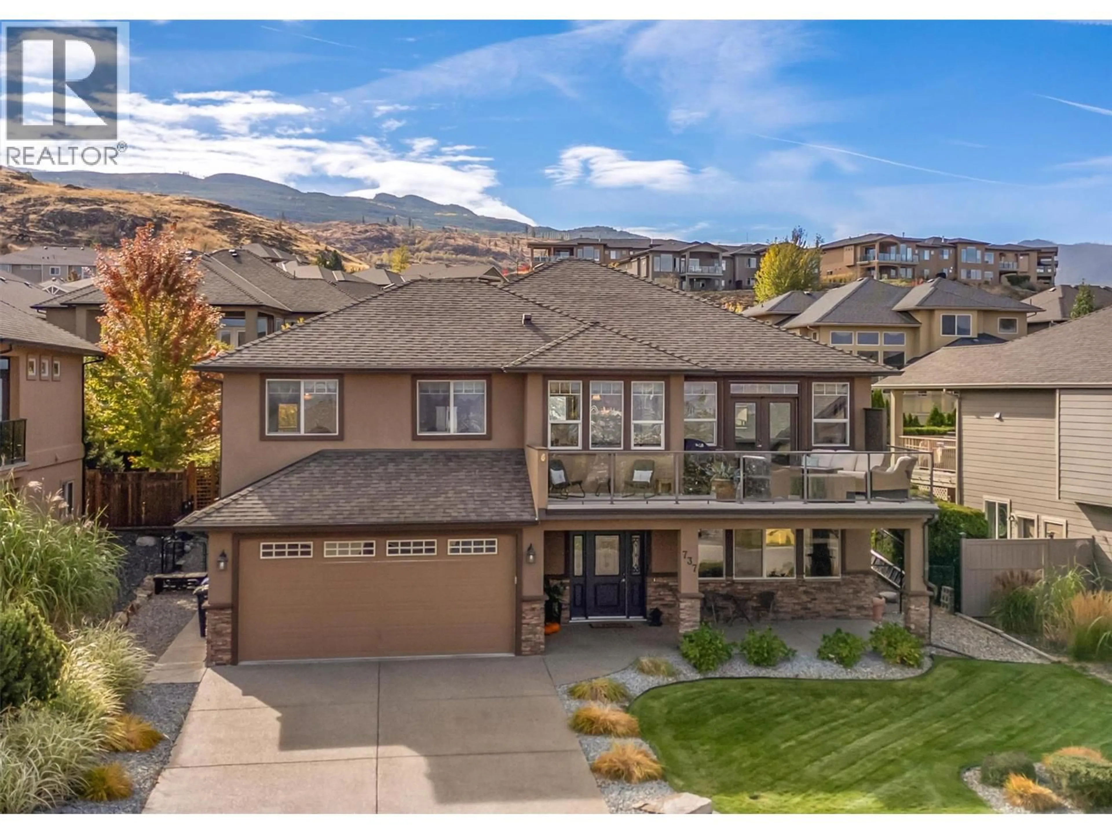 A pic from outside/outdoor area/front of a property/back of a property/a pic from drone, mountain view for 737 KUIPERS CRESCENT, Kelowna British Columbia V1W5H4