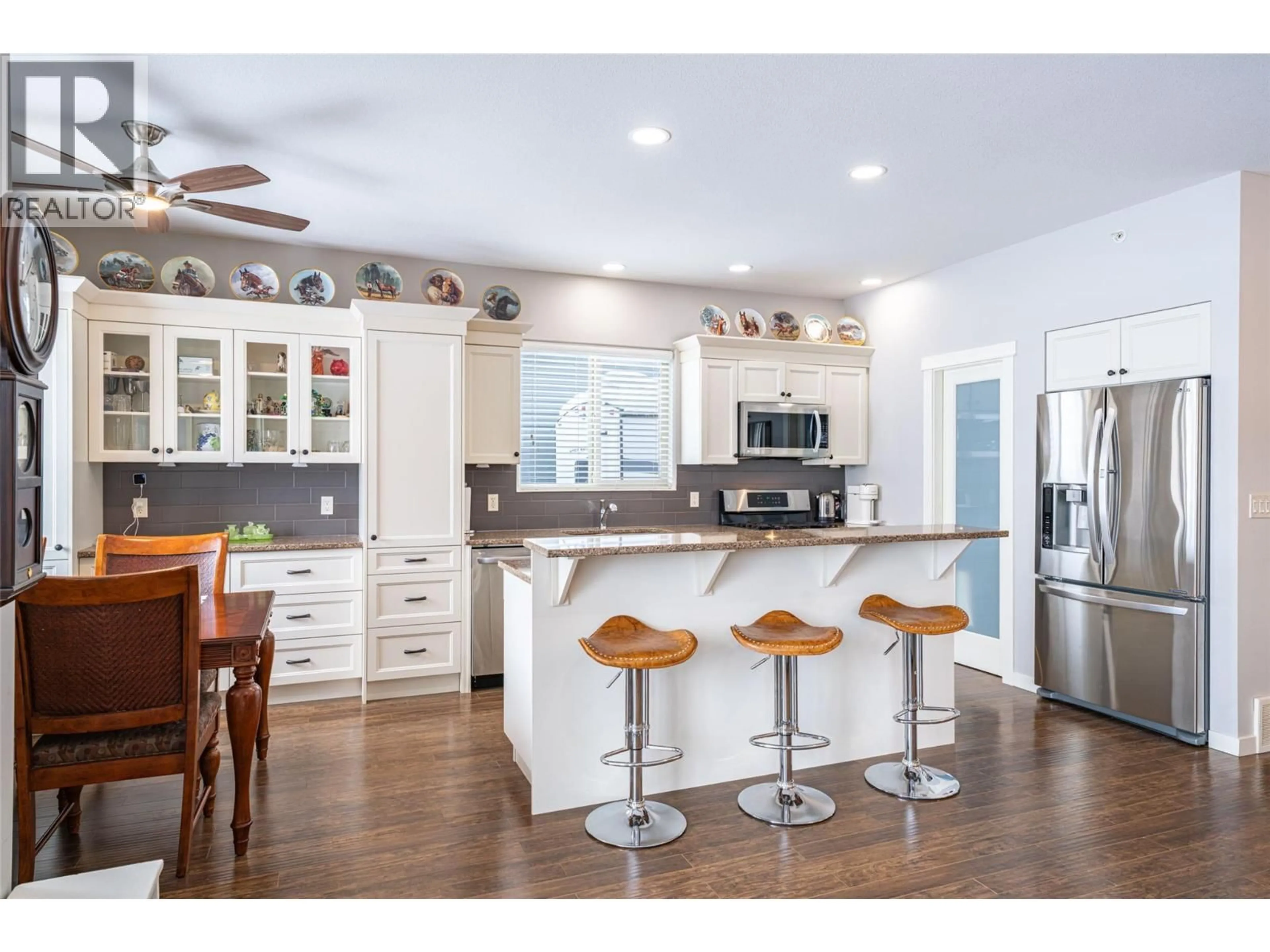 Open concept kitchen, wood/laminate floor for 27 - 2444 YORK AVENUE, Armstrong British Columbia V4Y0Y3