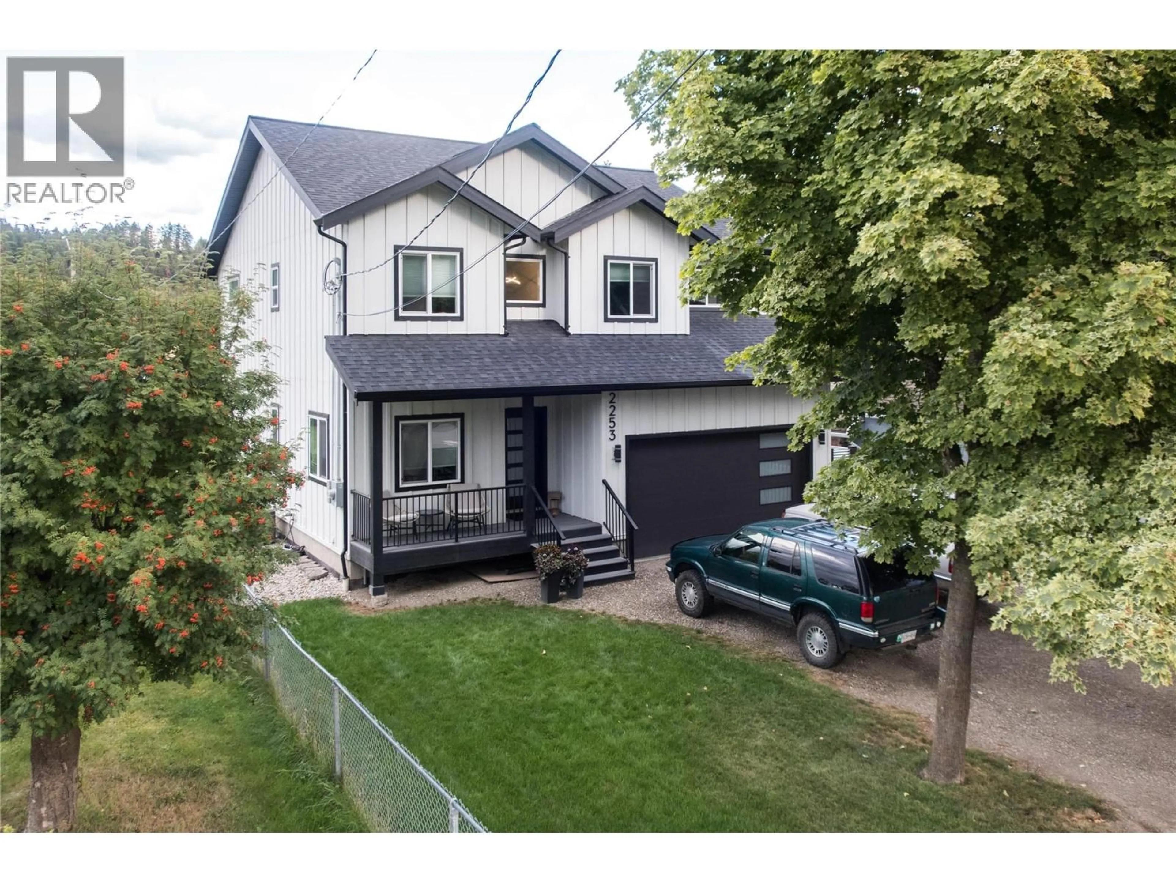 A pic from outside/outdoor area/front of a property/back of a property/a pic from drone, street for 2253 SHUSWAP AVENUE, Lumby British Columbia V0E2G0
