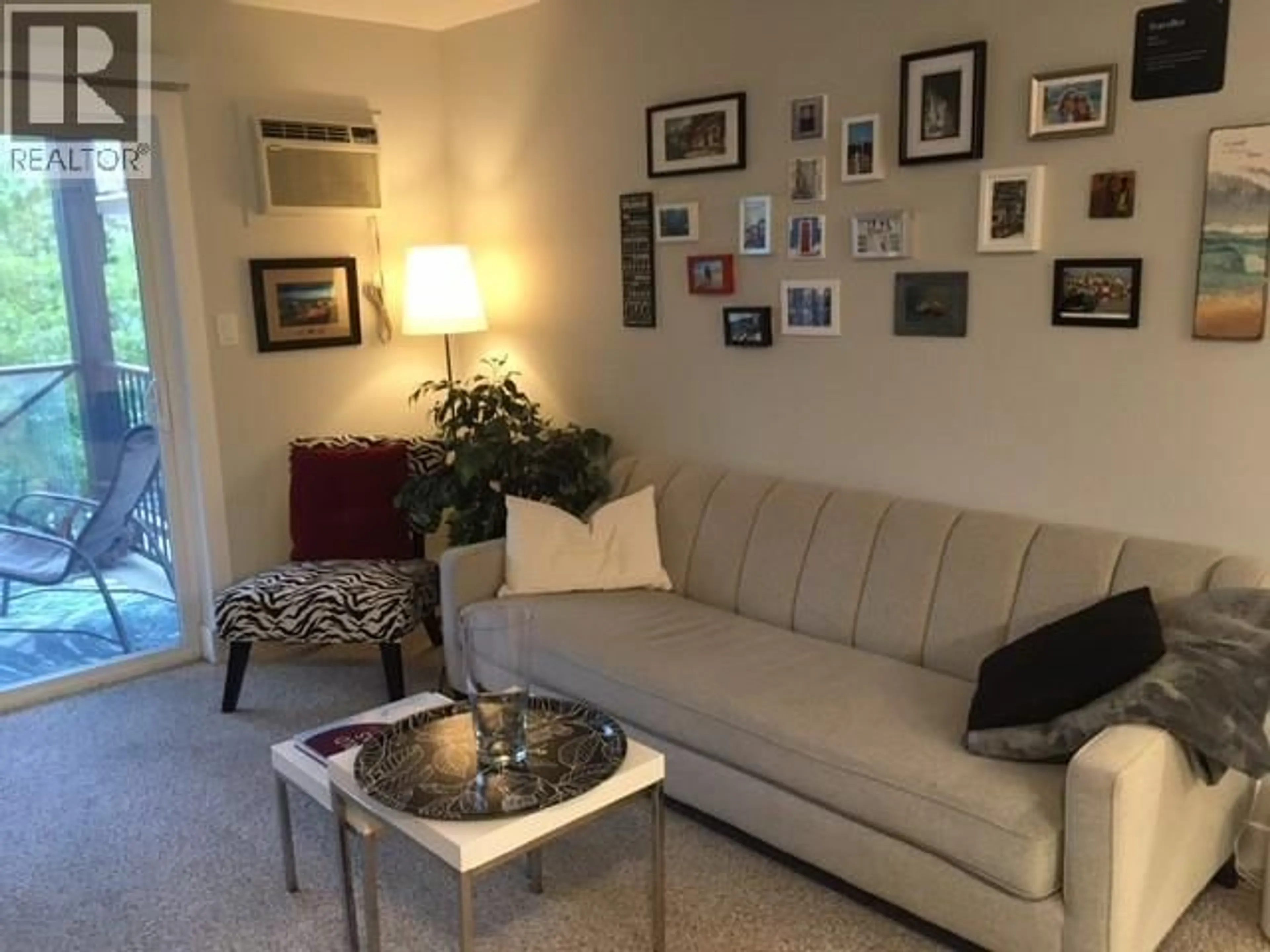 Living room with furniture, unknown for 301 - 256 HASTINGS AVENUE, Penticton British Columbia V2A2V6