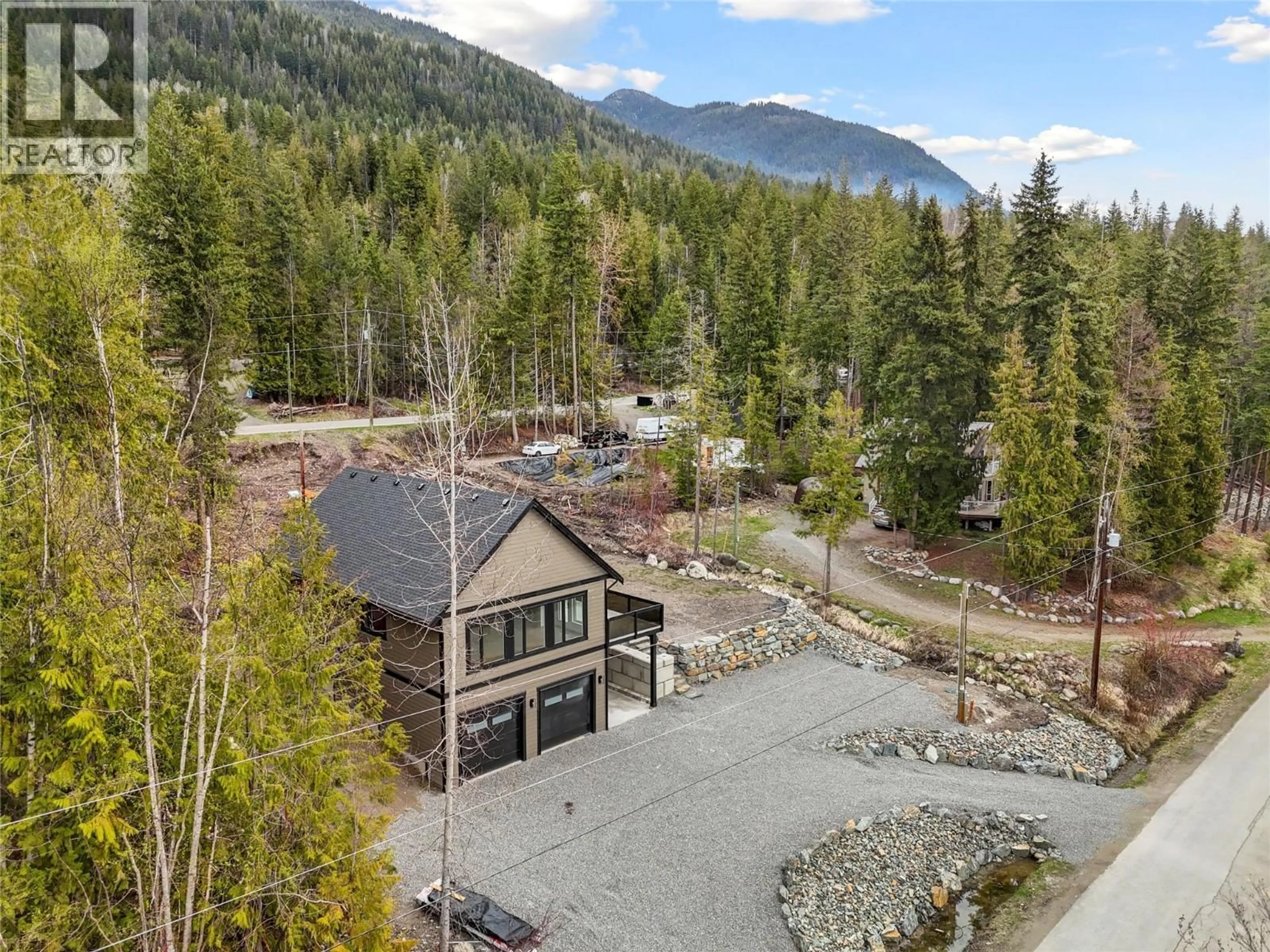 A pic from outside/outdoor area/front of a property/back of a property/a pic from drone, mountain view for 7455 STAMPEDE TRAIL, Anglemont British Columbia V0E1M8