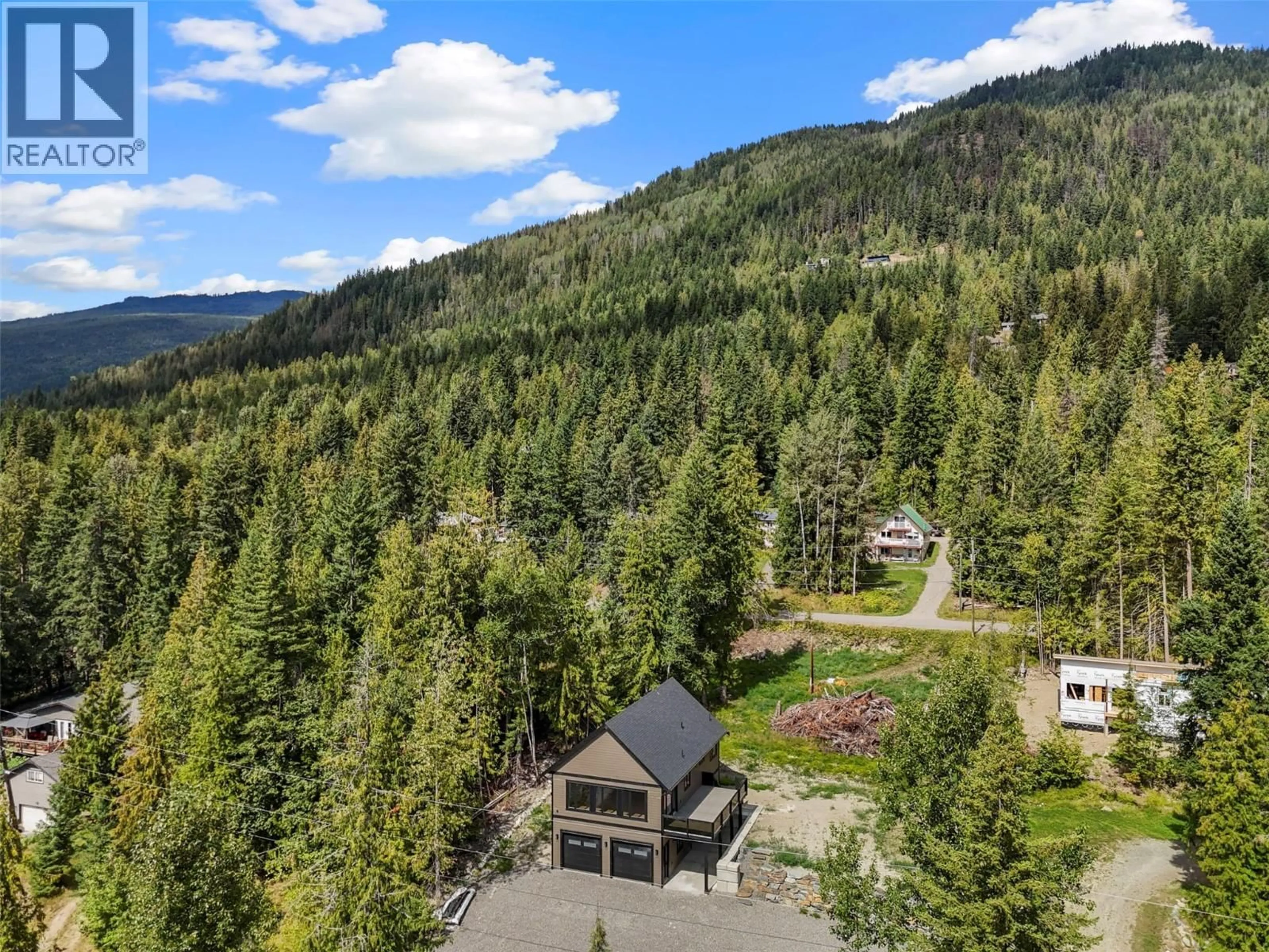 A pic from outside/outdoor area/front of a property/back of a property/a pic from drone, mountain view for 7455 STAMPEDE TRAIL, Anglemont British Columbia V0E1M8