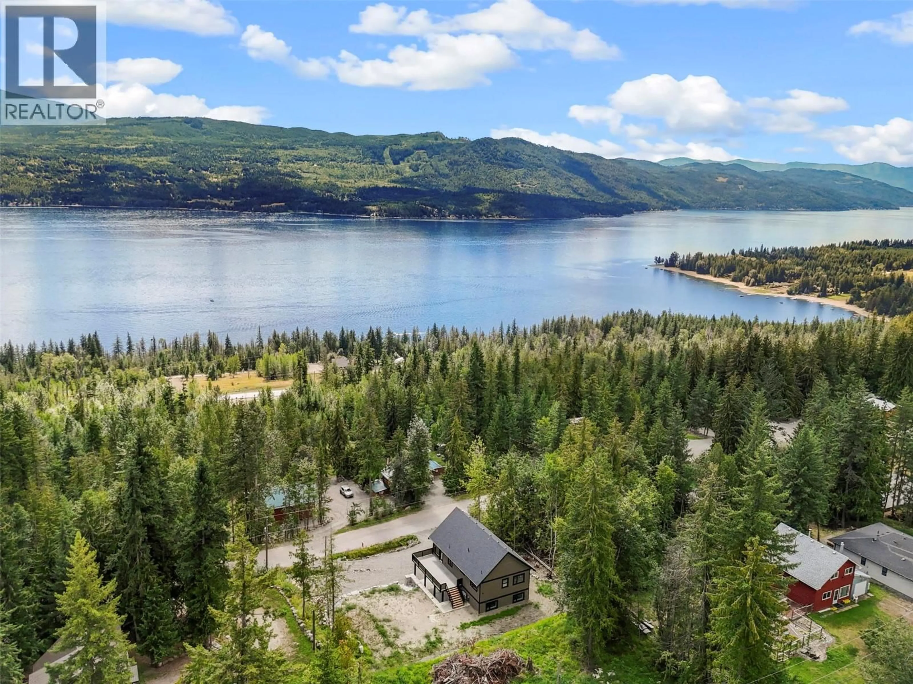 A pic from outside/outdoor area/front of a property/back of a property/a pic from drone, water/lake/river/ocean view for 7455 STAMPEDE TRAIL, Anglemont British Columbia V0E1M8