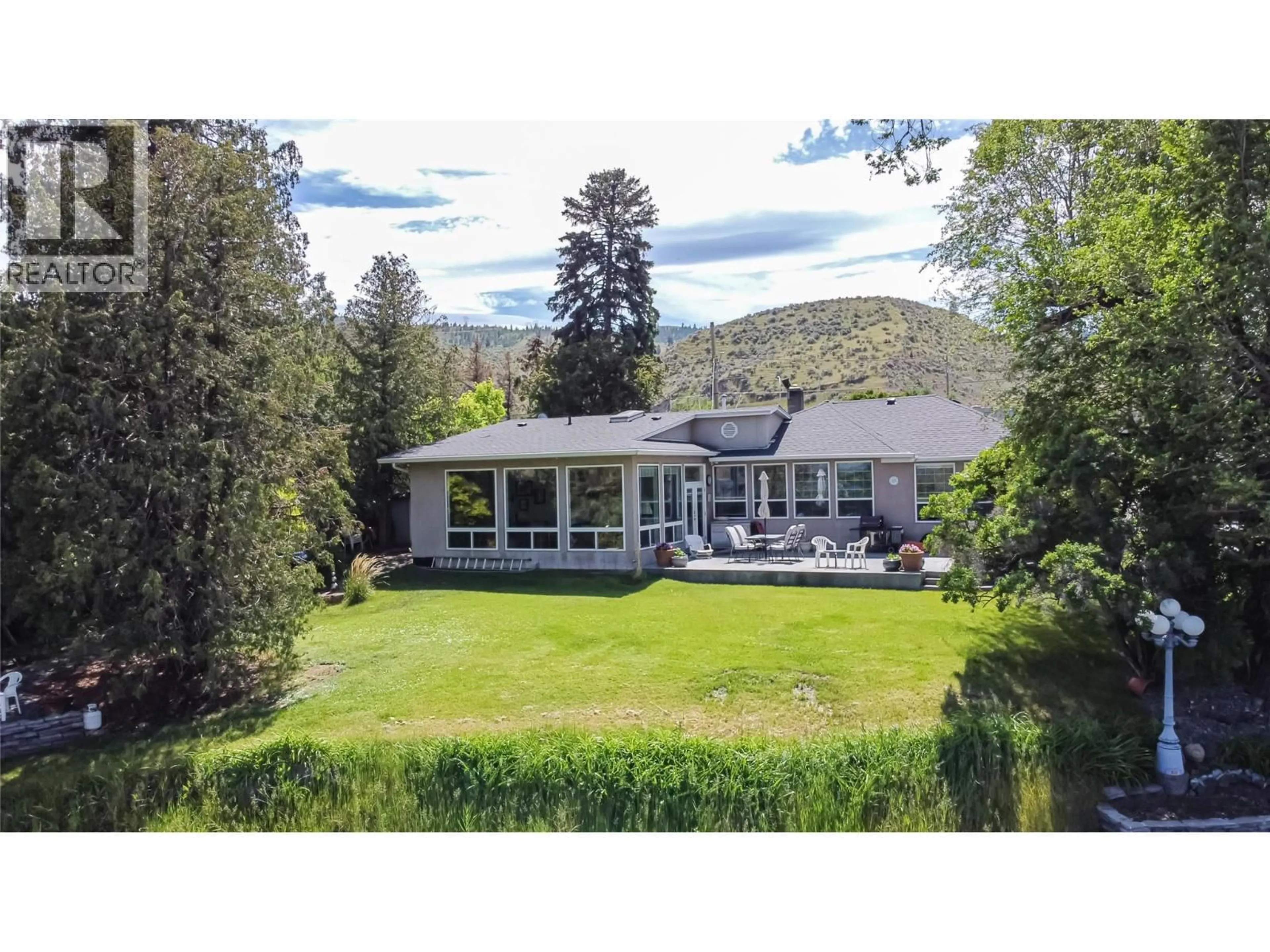 A pic from outside/outdoor area/front of a property/back of a property/a pic from drone, mountain view for 1590 LORNE STREET EAST, Kamloops British Columbia V2C1X6