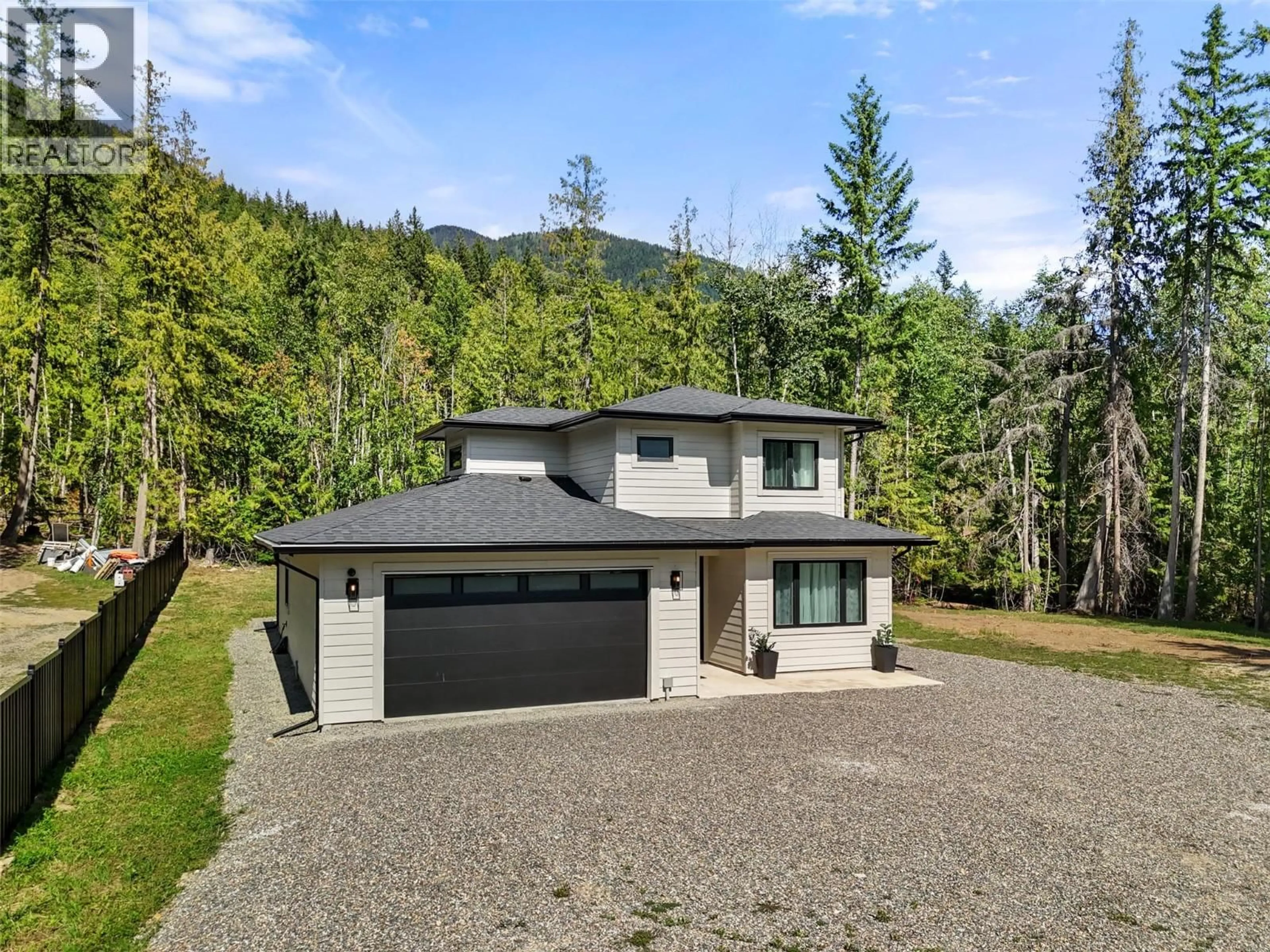 A pic from outside/outdoor area/front of a property/back of a property/a pic from drone, mountain view for 7670 MOUNTAIN DRIVE, Anglemont British Columbia V0E1M8