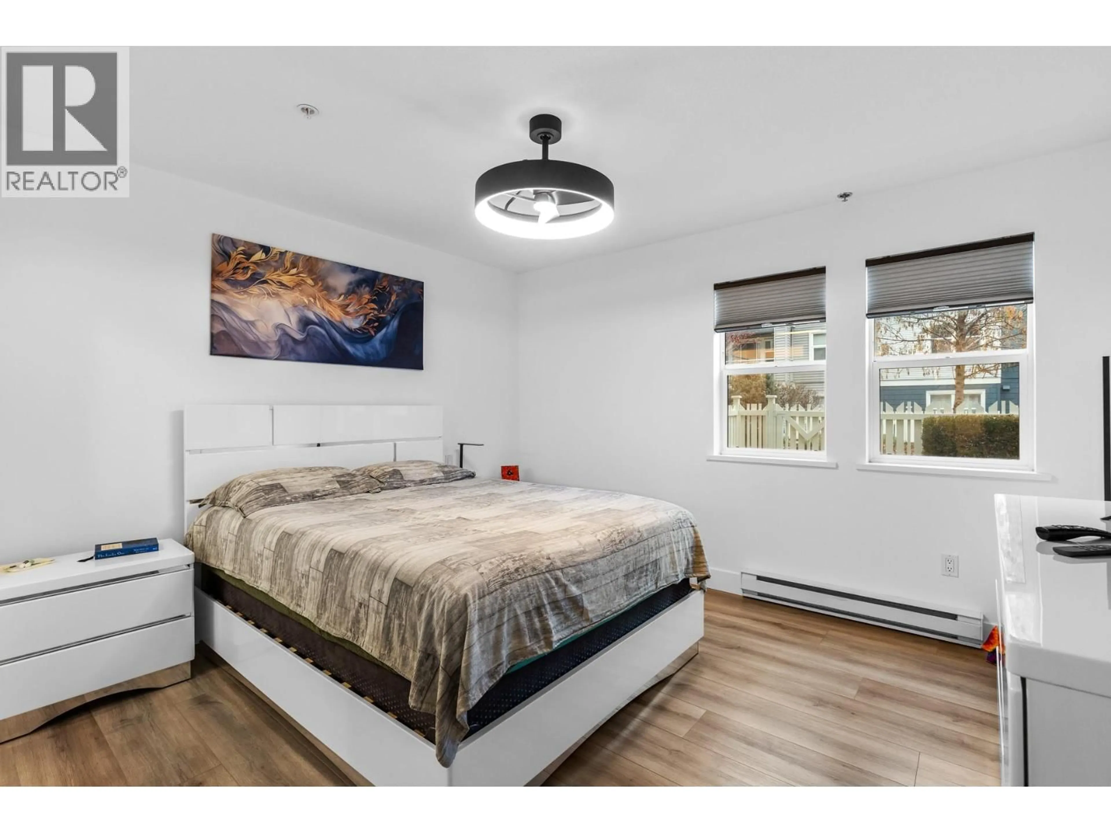 Bedroom with bed, wood/laminate floor for 115 - 555 YATES ROAD, Kelowna British Columbia V1V2V2