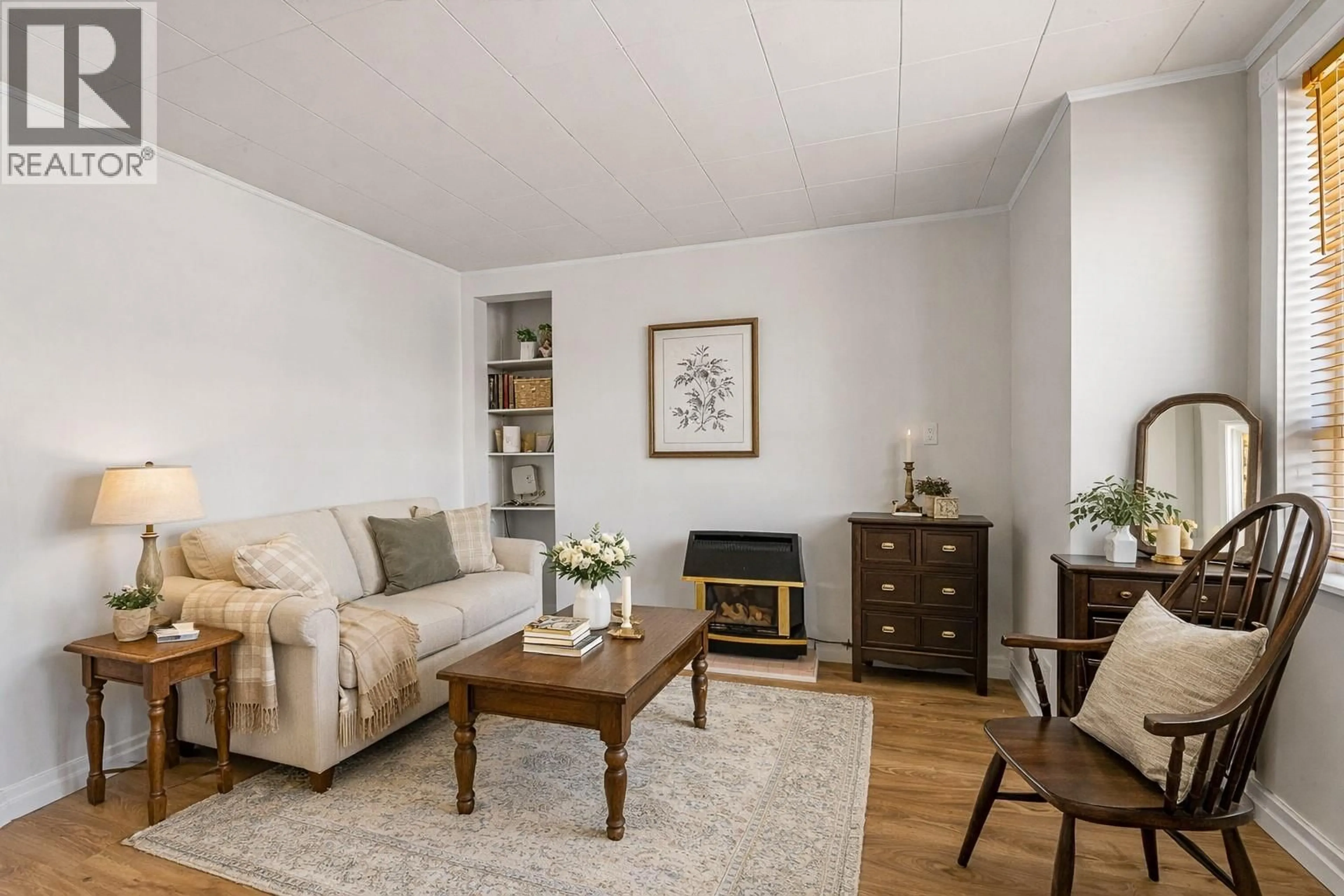 Living room with furniture, wood/laminate floor for 2438 JACKSON AVENUE, Merritt British Columbia V1K1B8