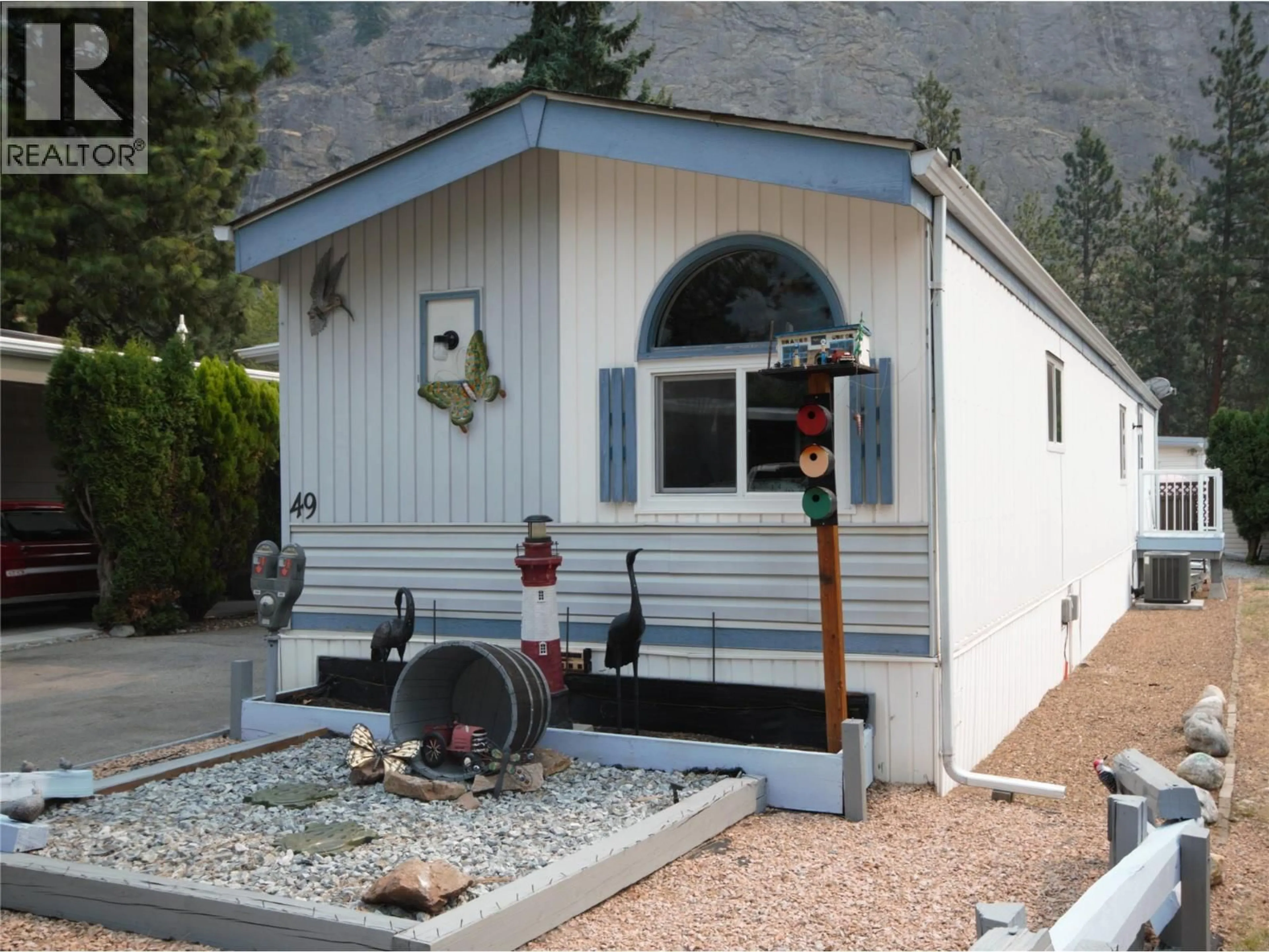 Home with vinyl exterior material, mountain view for 49 - 8487 HIGHWAY 97 OTHER, Oliver British Columbia V0H1T2