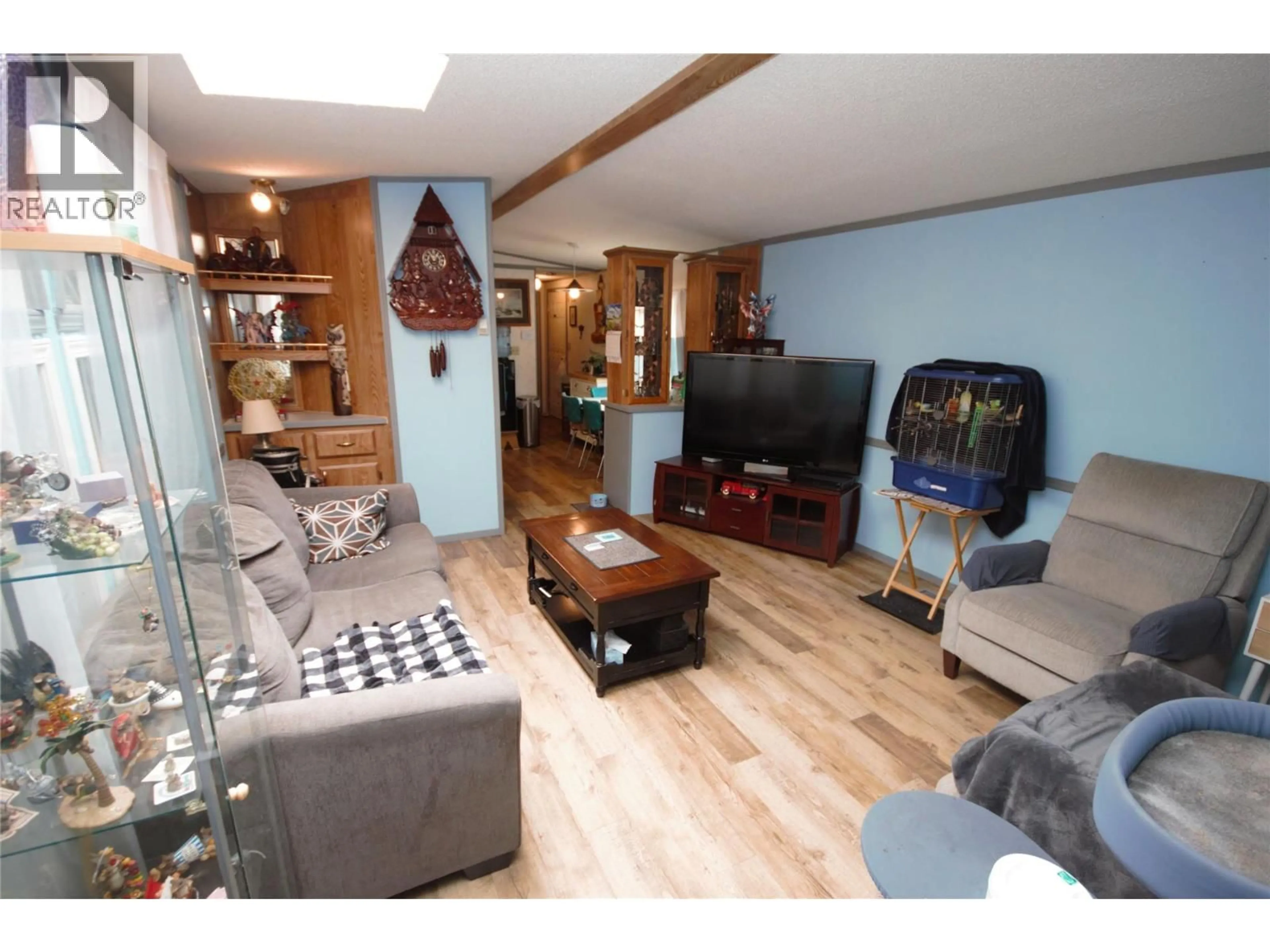 Living room with furniture, wood/laminate floor for 49 - 8487 HIGHWAY 97 OTHER, Oliver British Columbia V0H1T2