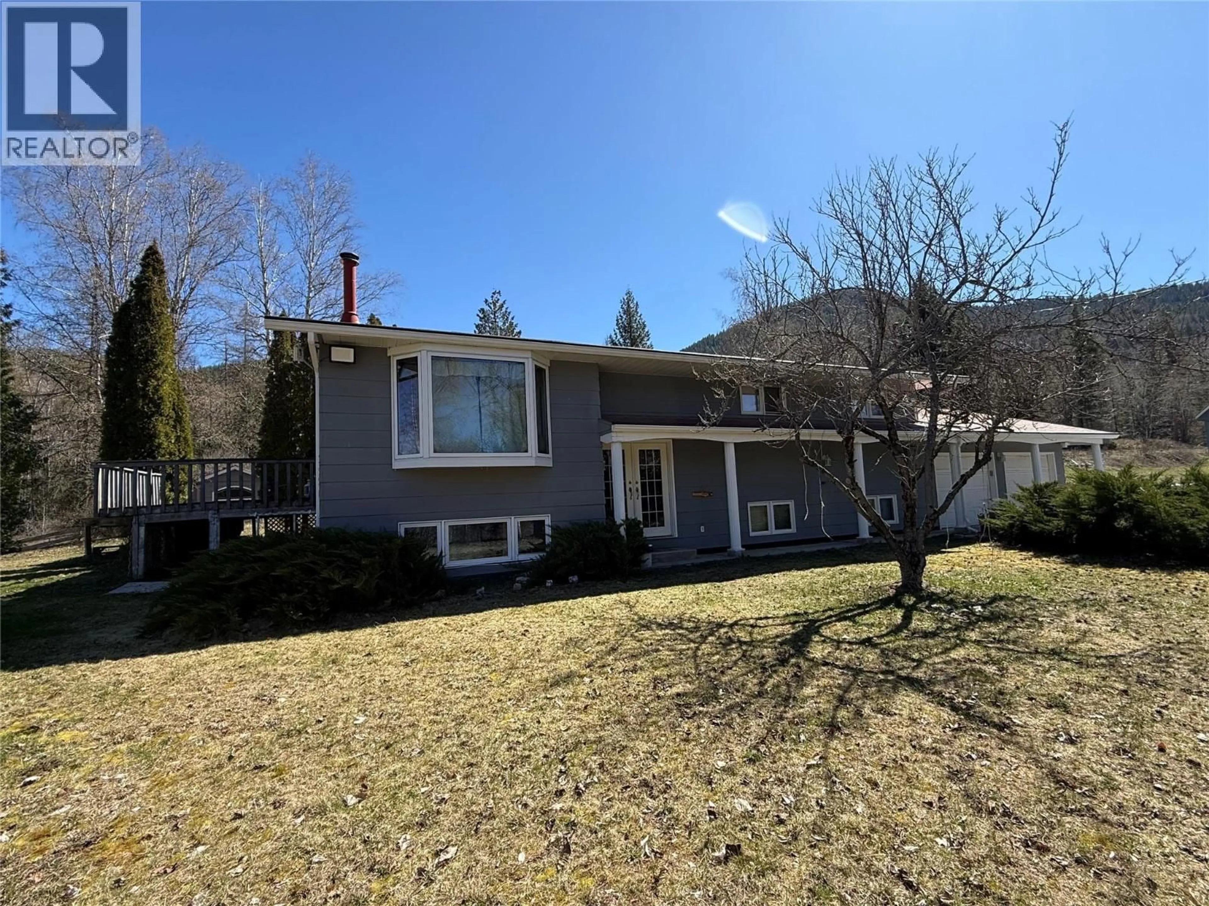 A pic from outside/outdoor area/front of a property/back of a property/a pic from drone, street for 1076 COLUMBIA GARDENS ROAD, Fruitvale British Columbia V0G1L1