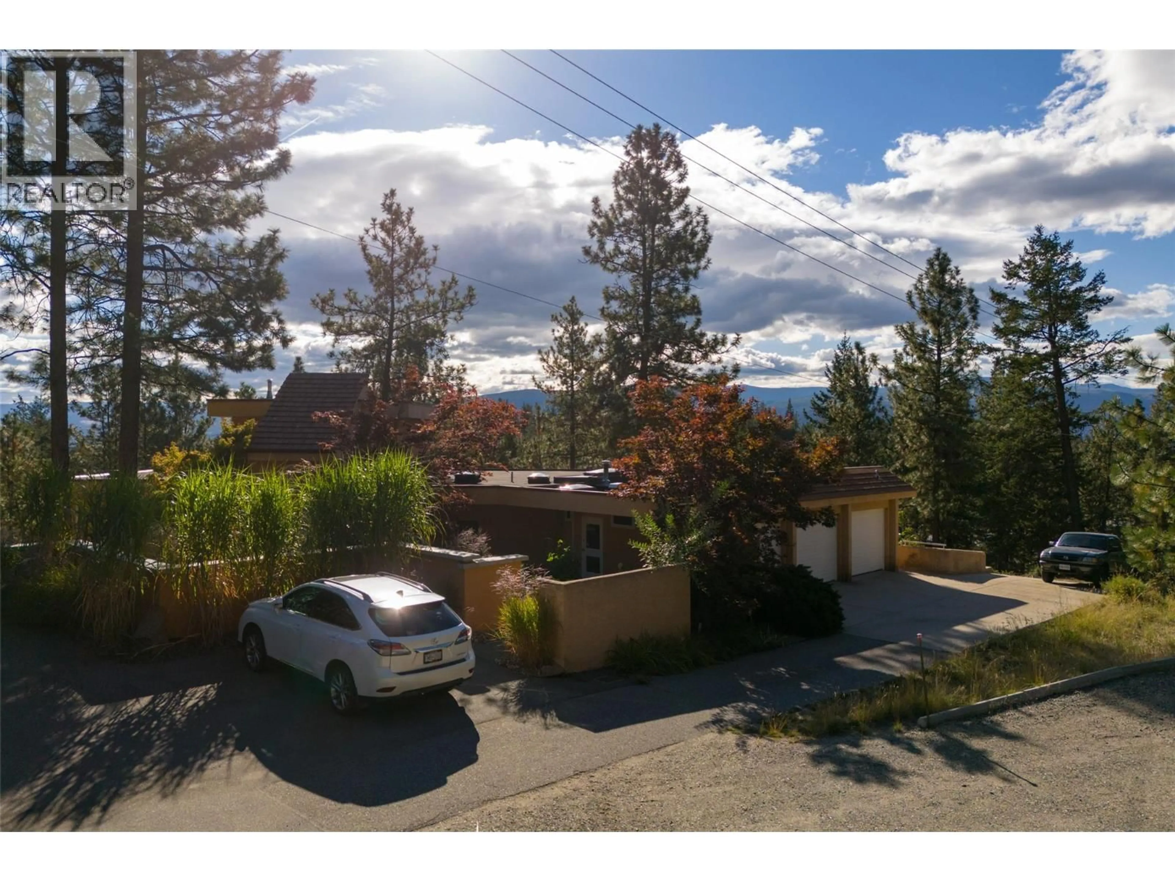 A pic from outside/outdoor area/front of a property/back of a property/a pic from drone, mountain view for 1642 WEST KELOWNA ROAD, West Kelowna British Columbia V1Z3B7