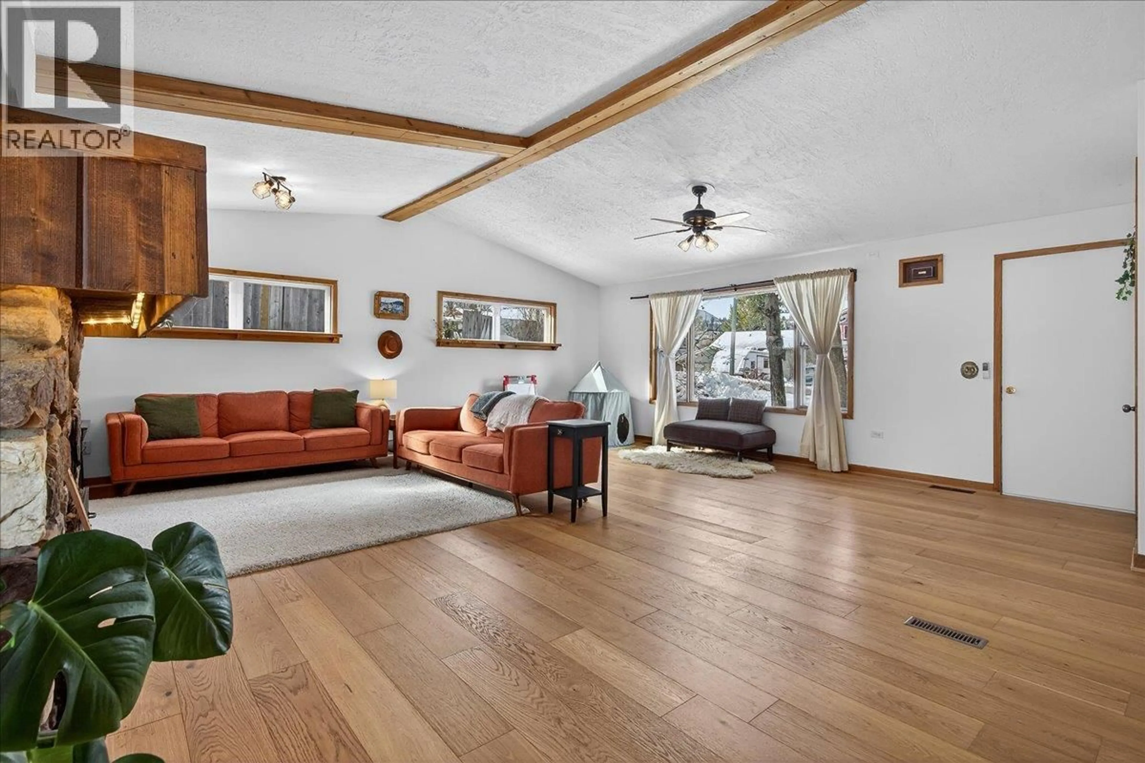 Living room with furniture, wood/laminate floor for 101 11TH AVENUE, Invermere British Columbia V0A1K0