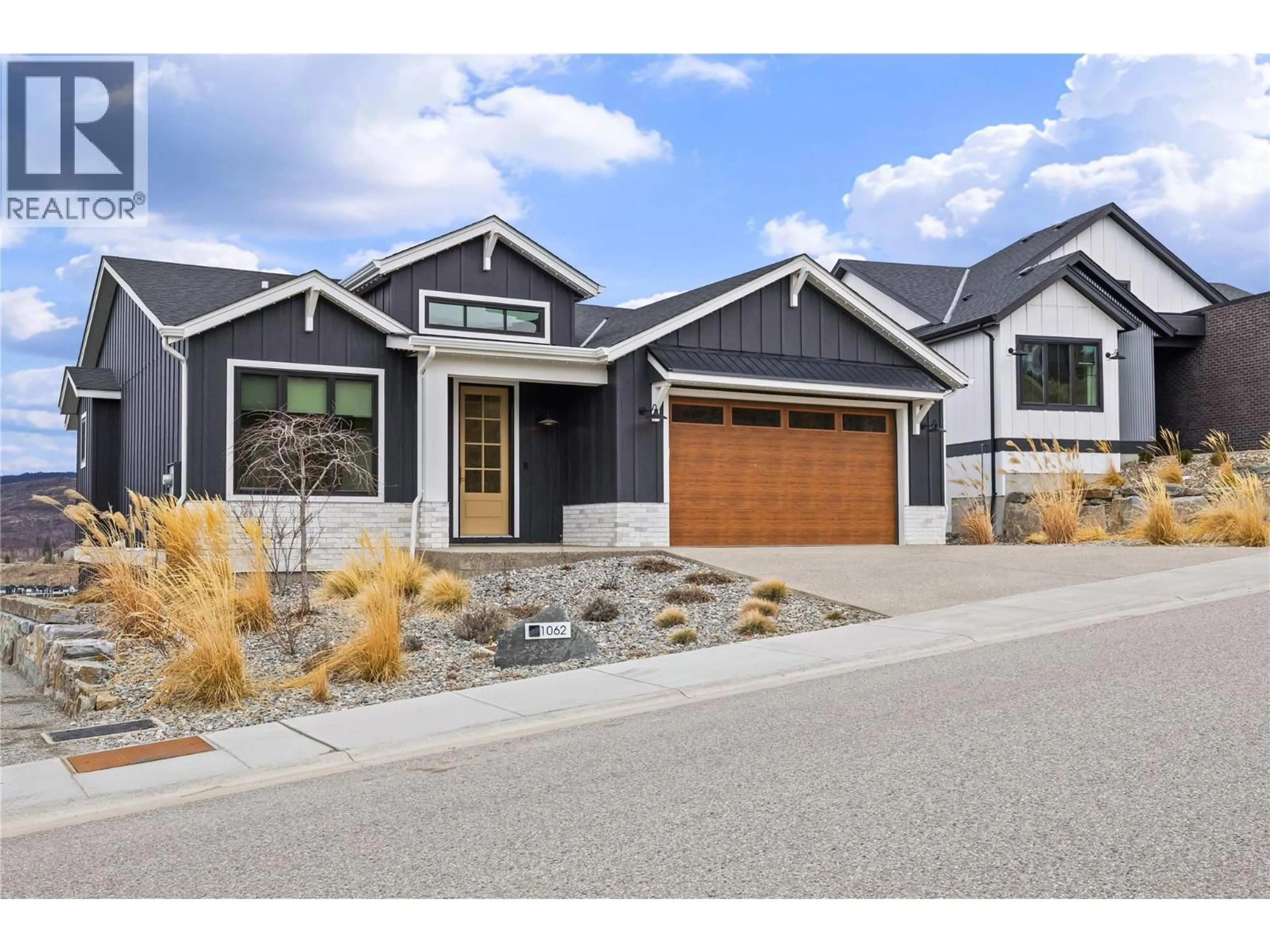 Home with brick exterior material, street for 1062 EMSLIE STREET, Kelowna British Columbia V1W0C3