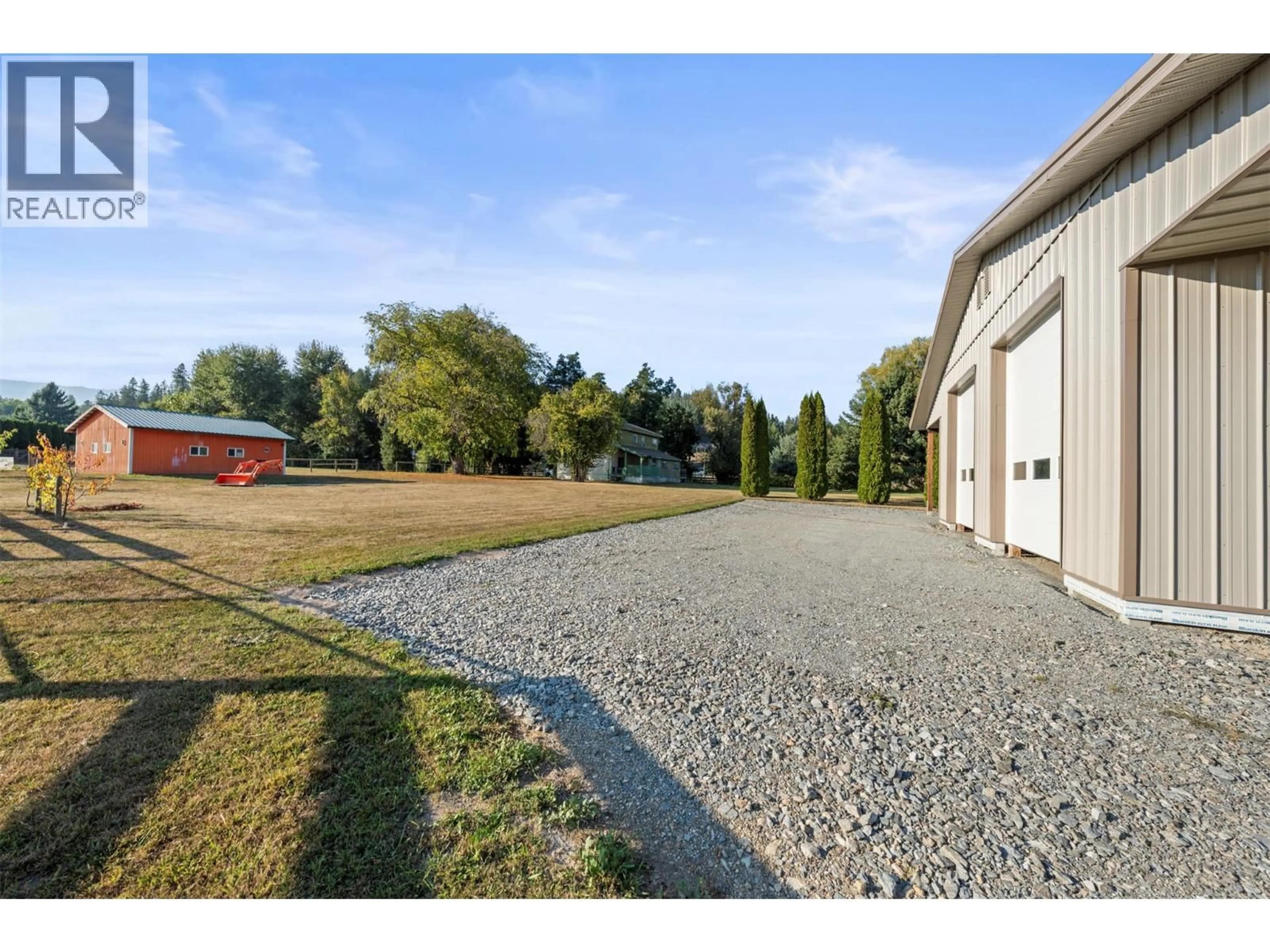 A pic from outside/outdoor area/front of a property/back of a property/a pic from drone, street for 6619 97A HIGHWAY NORTH, Enderby British Columbia V0E1V3