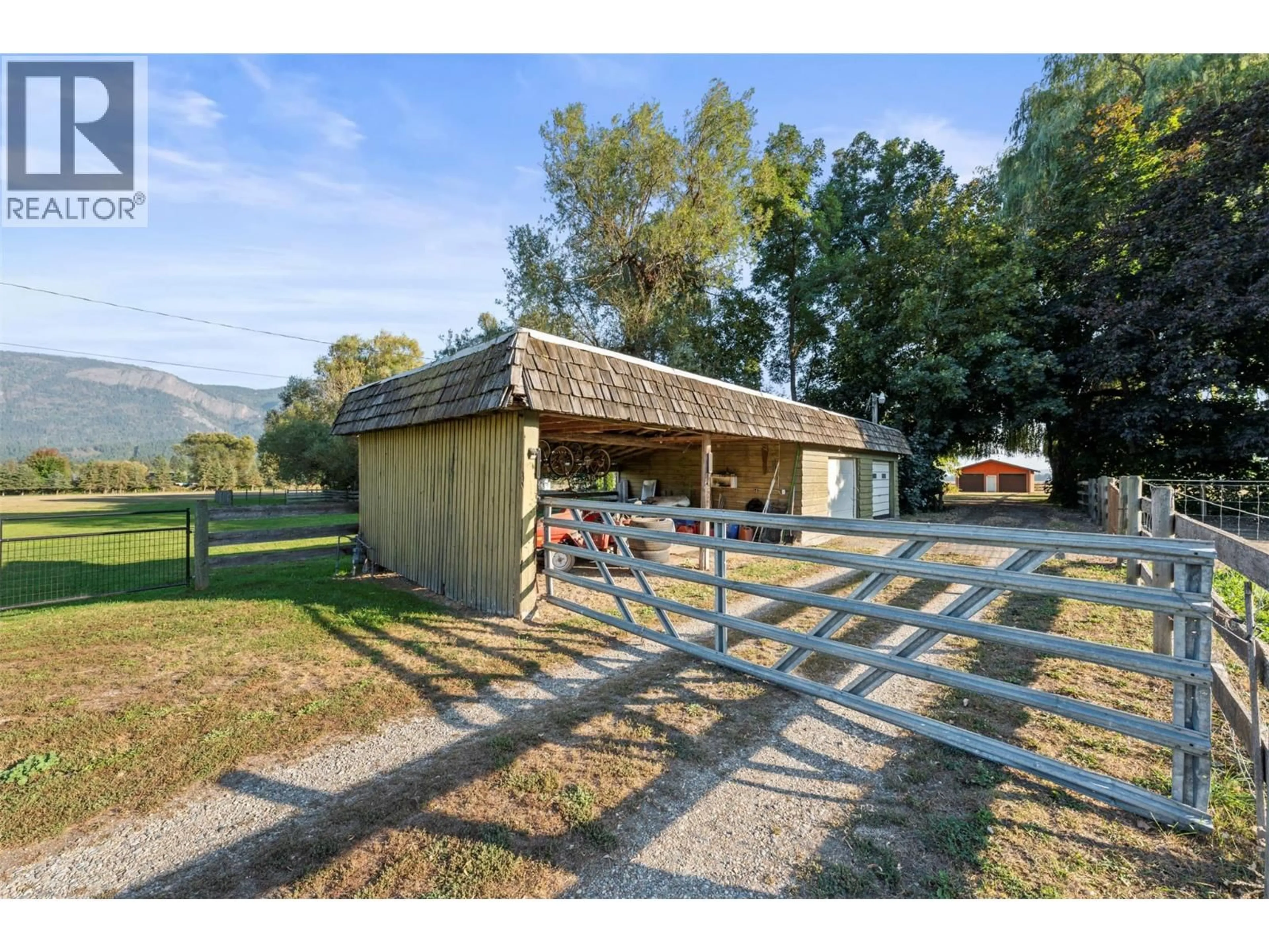 A pic from outside/outdoor area/front of a property/back of a property/a pic from drone, mountain view for 6619 97A HIGHWAY NORTH, Enderby British Columbia V0E1V3