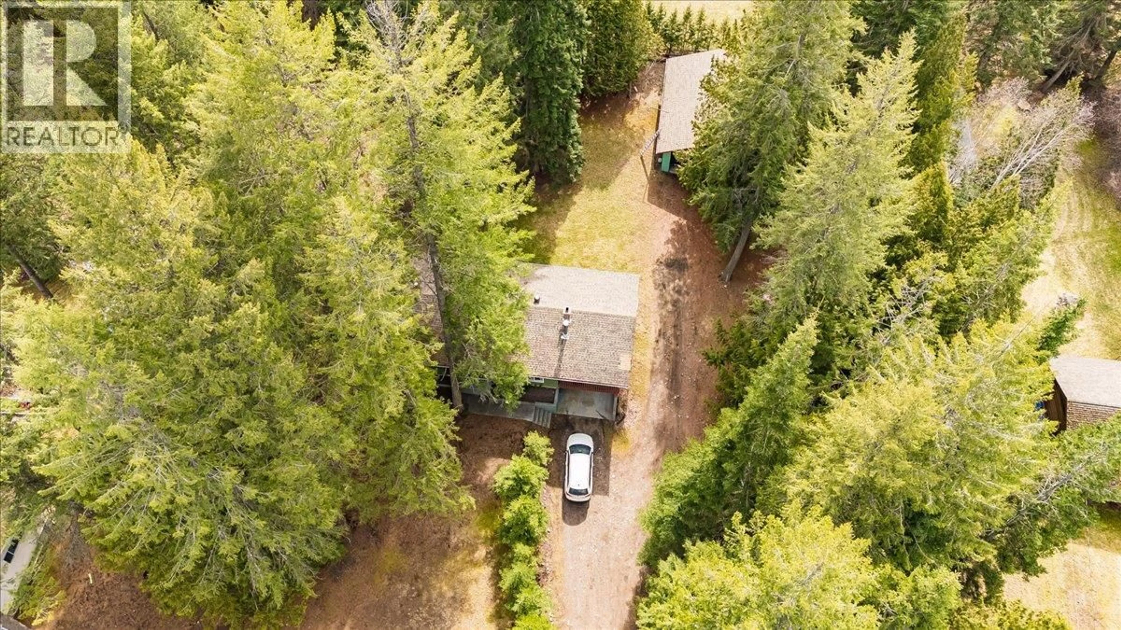 A pic from outside/outdoor area/front of a property/back of a property/a pic from drone, forest/trees view for 1055 WHITE ROAD, South Slocan British Columbia V0G2G0