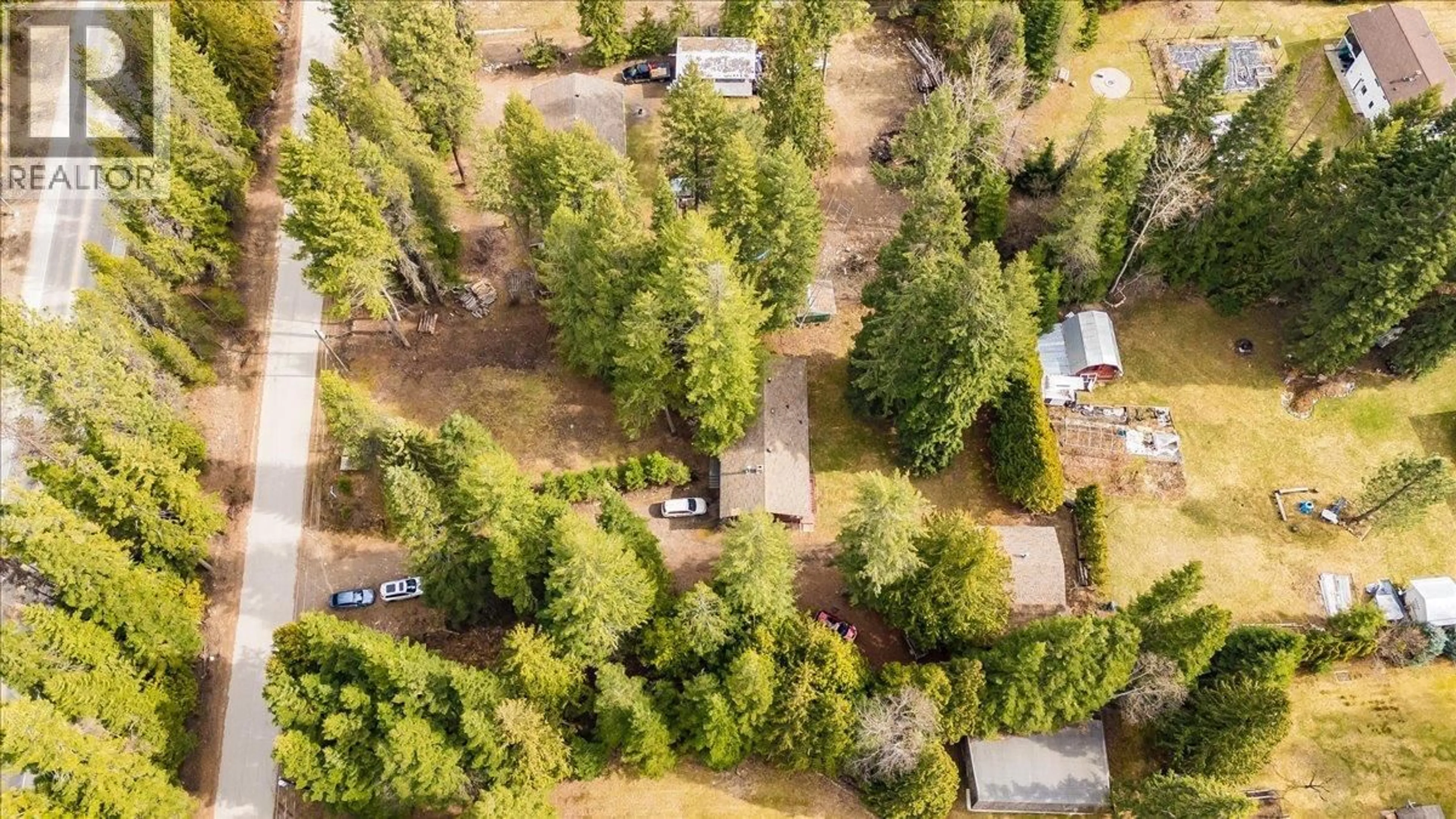 A pic from outside/outdoor area/front of a property/back of a property/a pic from drone, forest/trees view for 1055 WHITE ROAD, South Slocan British Columbia V0G2G0