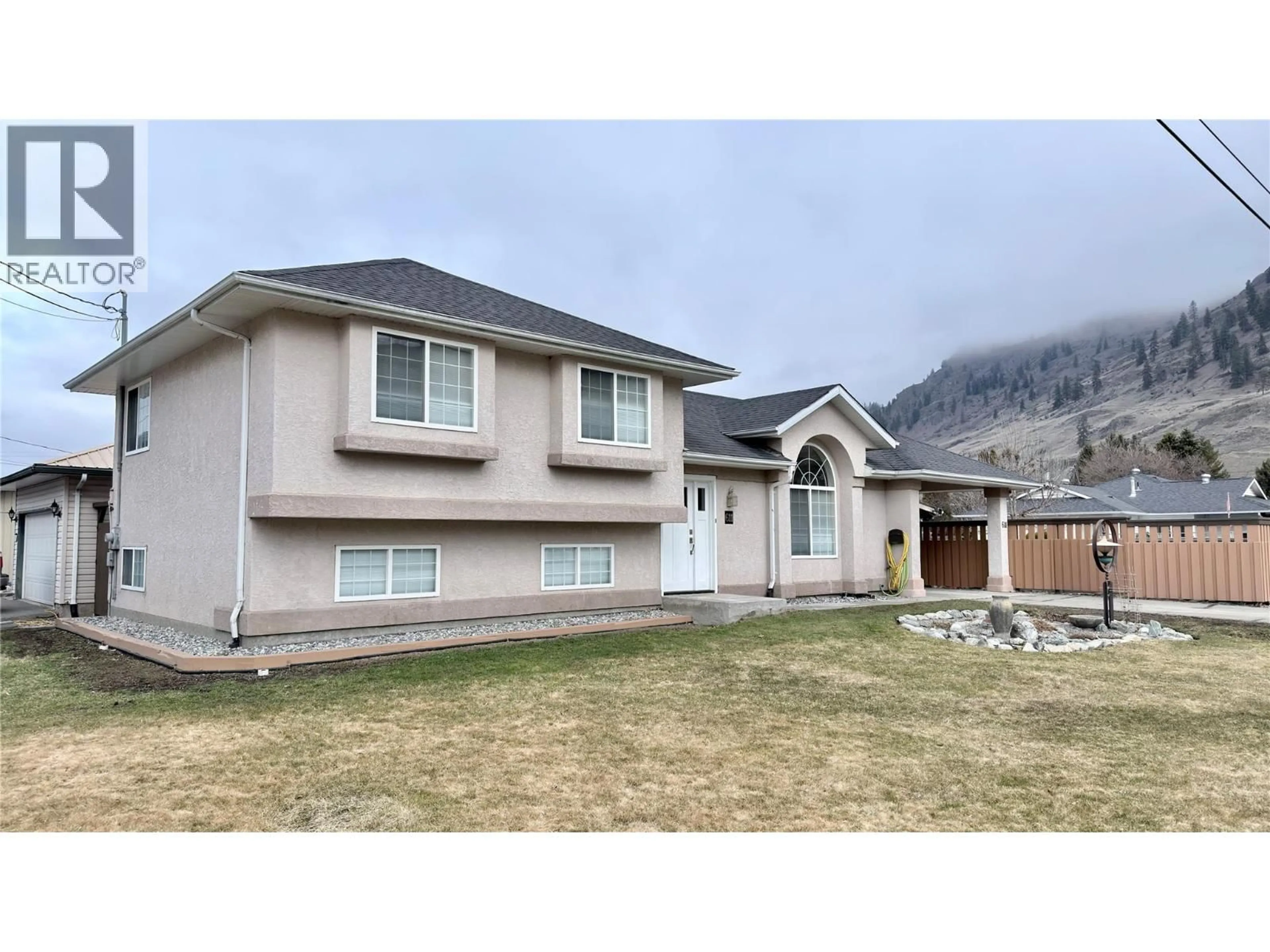 Home with vinyl exterior material, mountain view for 611 GERTRUDE STREET, Midway British Columbia V0H1M0