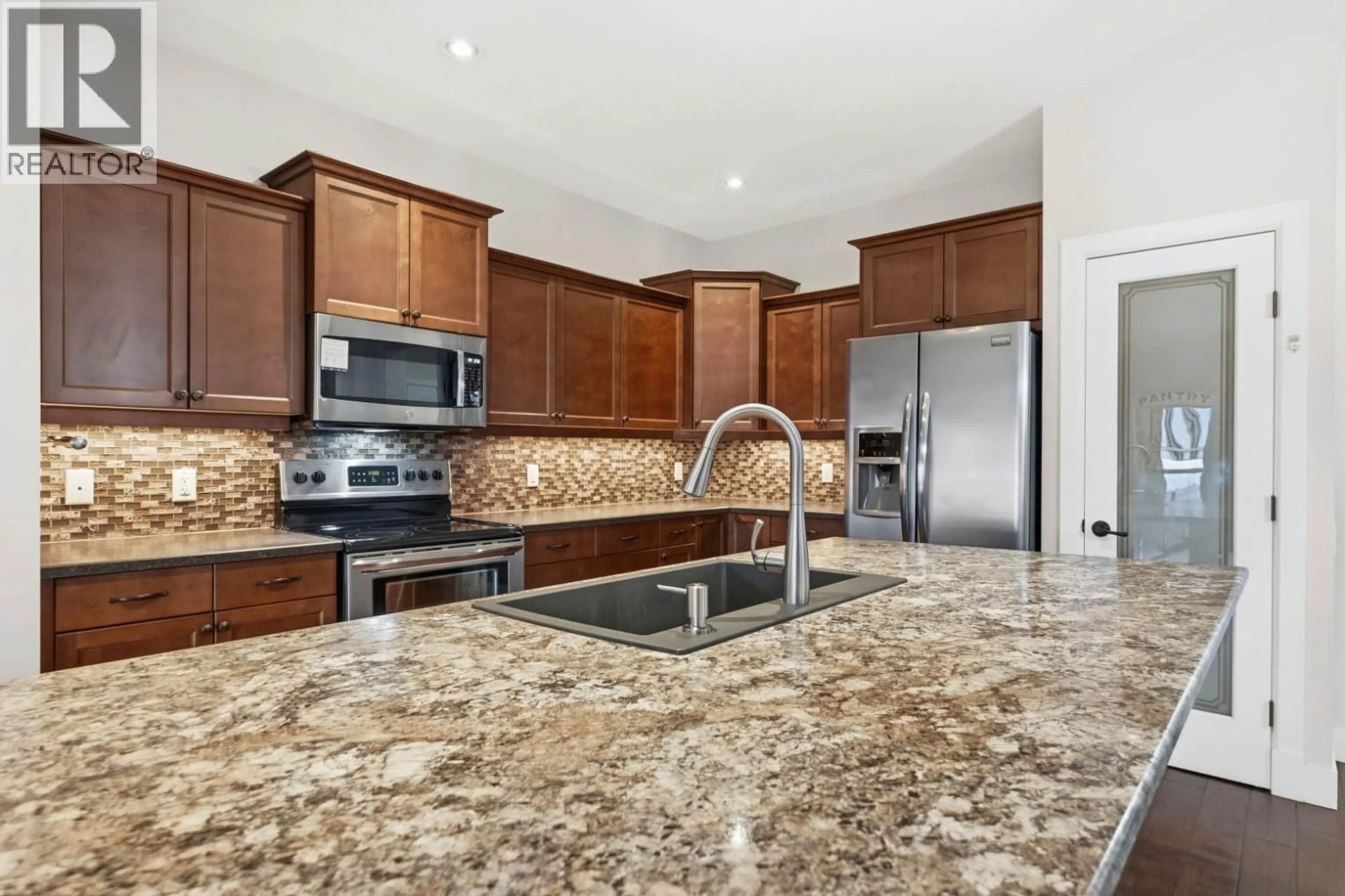 Open concept kitchen, ceramic/tile floor for 3804 SIRINGO LANE, Westbank British Columbia V4T3G4