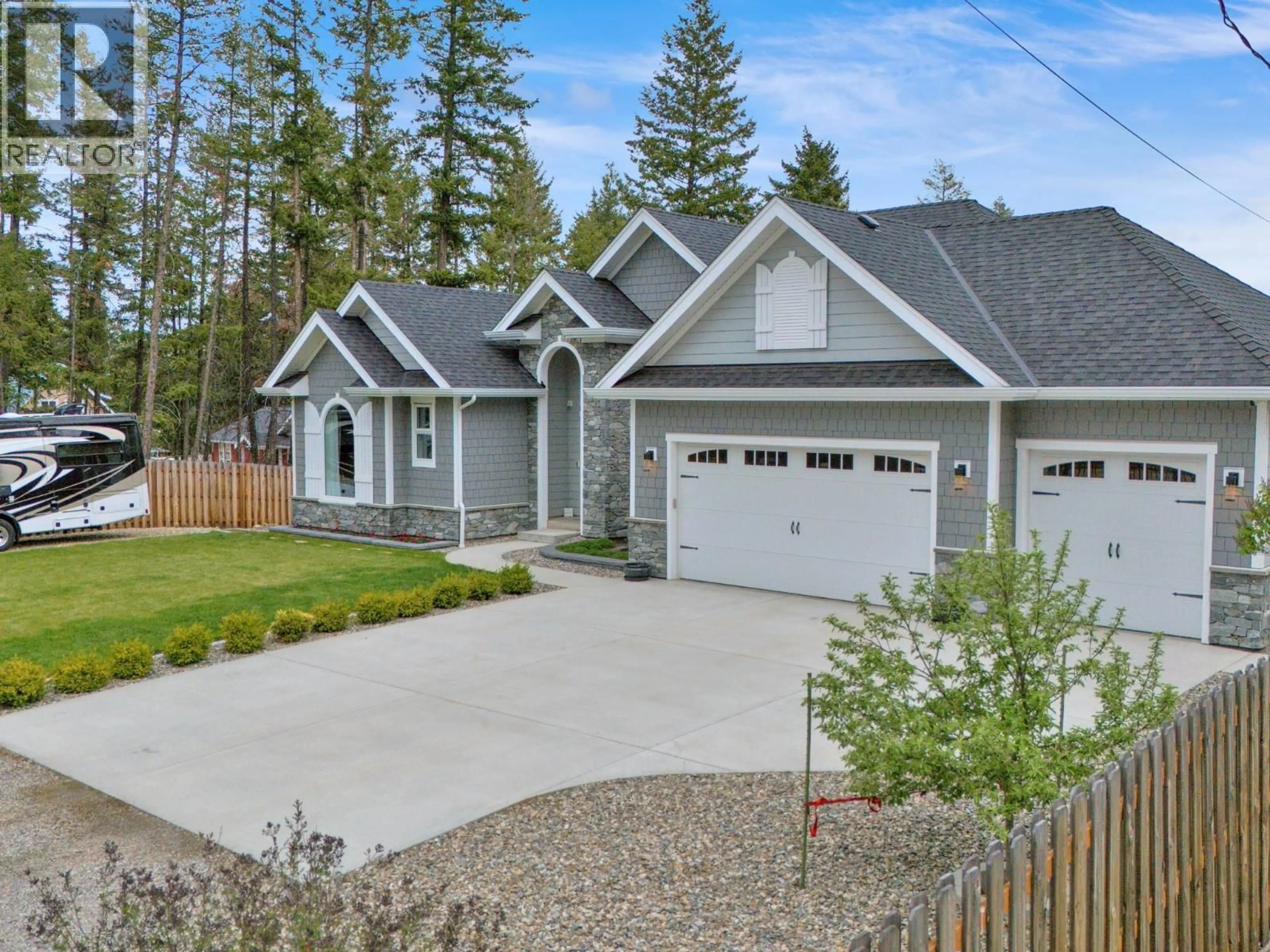 Home with vinyl exterior material, street for 7255 DUNWATERS ROAD, Kelowna British Columbia V1Z3W4