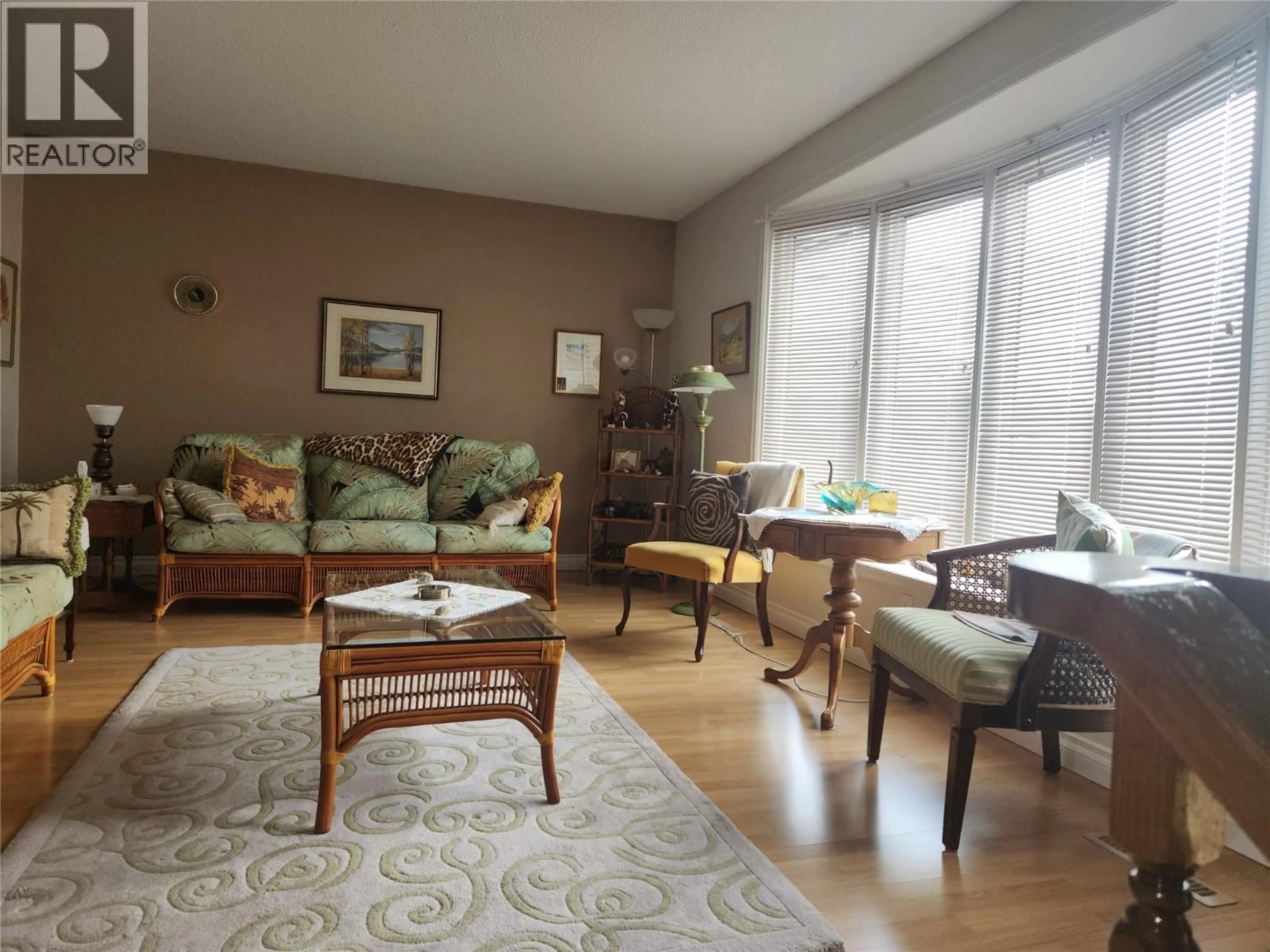 Living room with furniture, wood/laminate floor for 36 FINCH CRESCENT, Osoyoos British Columbia V0H1V0