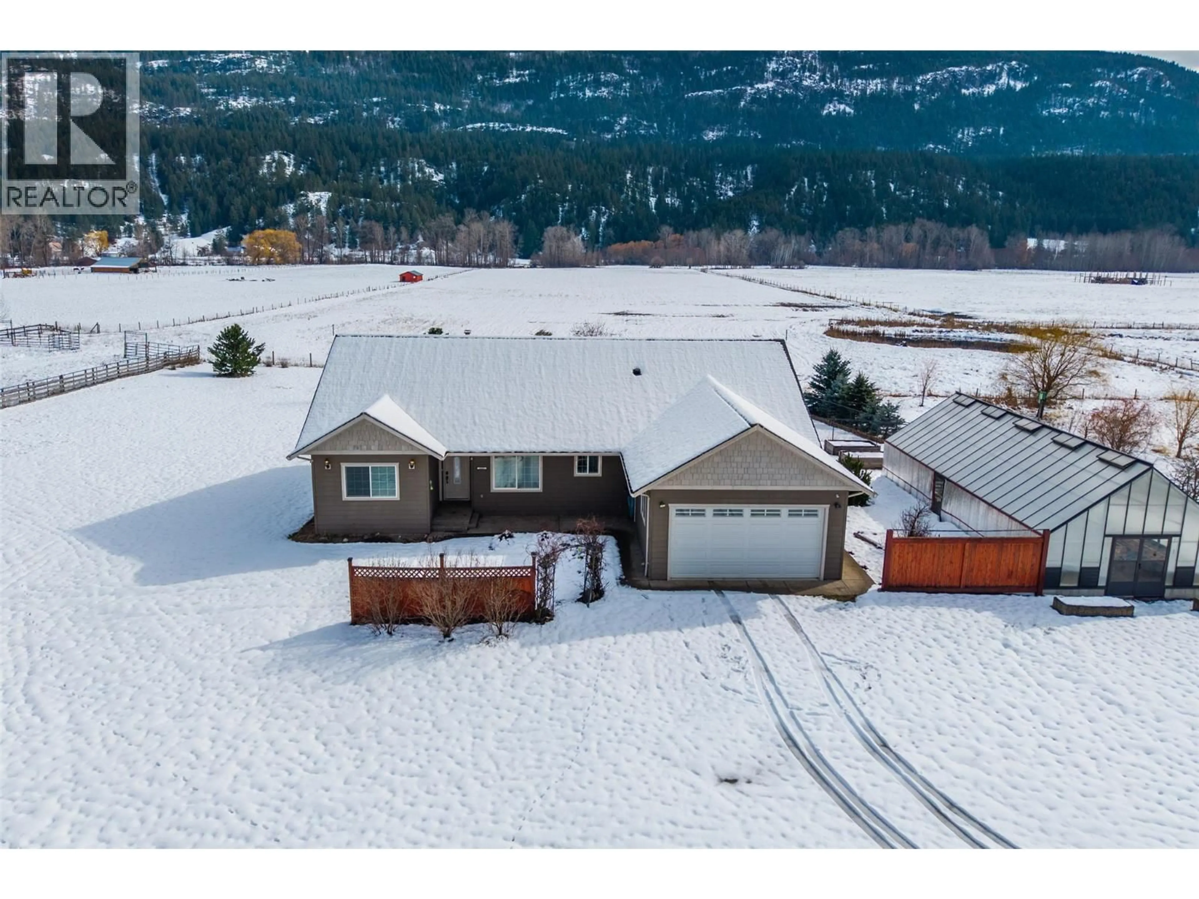 A pic from outside/outdoor area/front of a property/back of a property/a pic from drone, mountain view for 1027 SALMON RIVER ROAD, Salmon Arm British Columbia V1E3G3