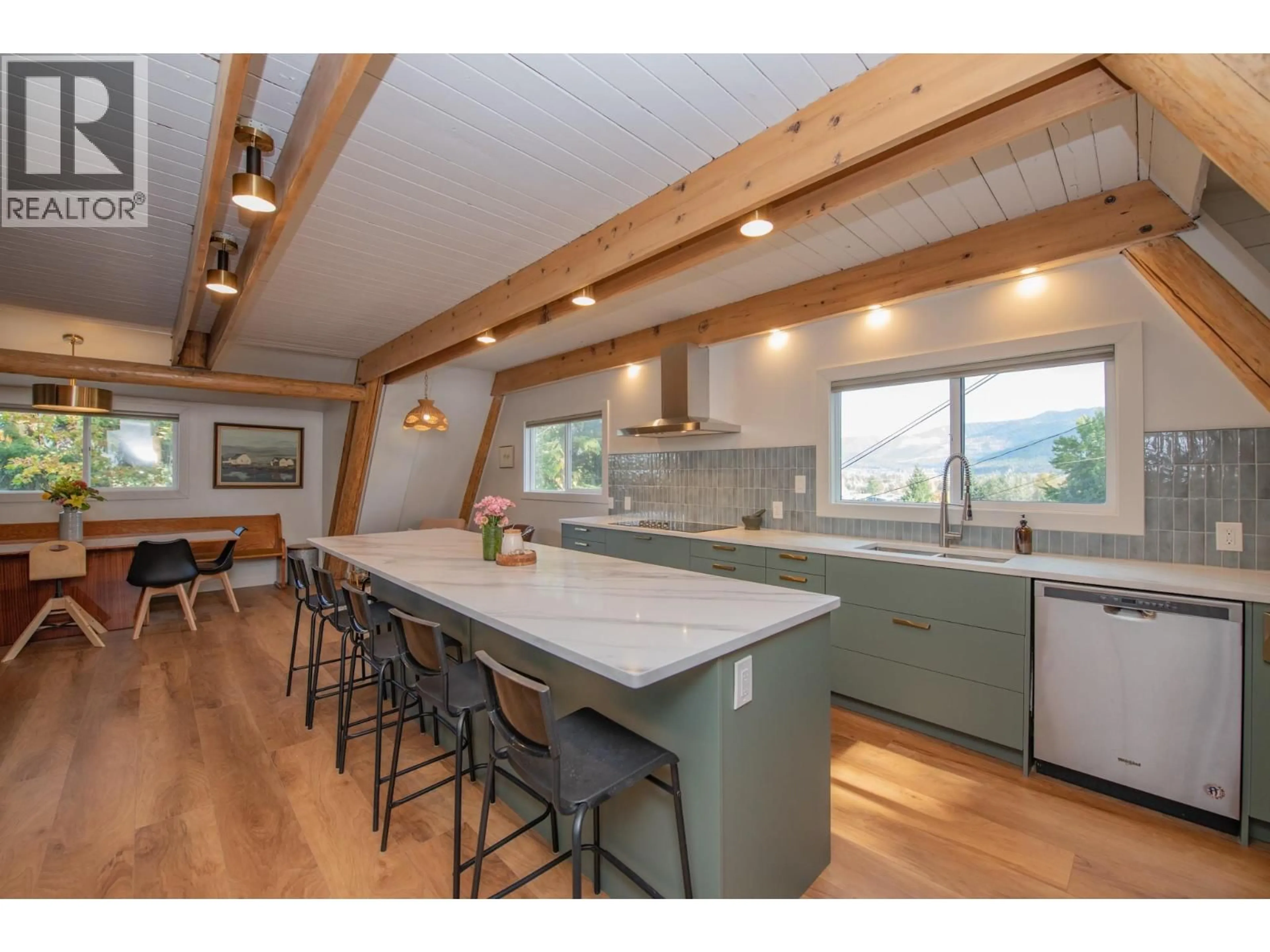 Open concept kitchen, wood/laminate floor for 2180 CATT AVENUE, Lumby British Columbia V0E2G0
