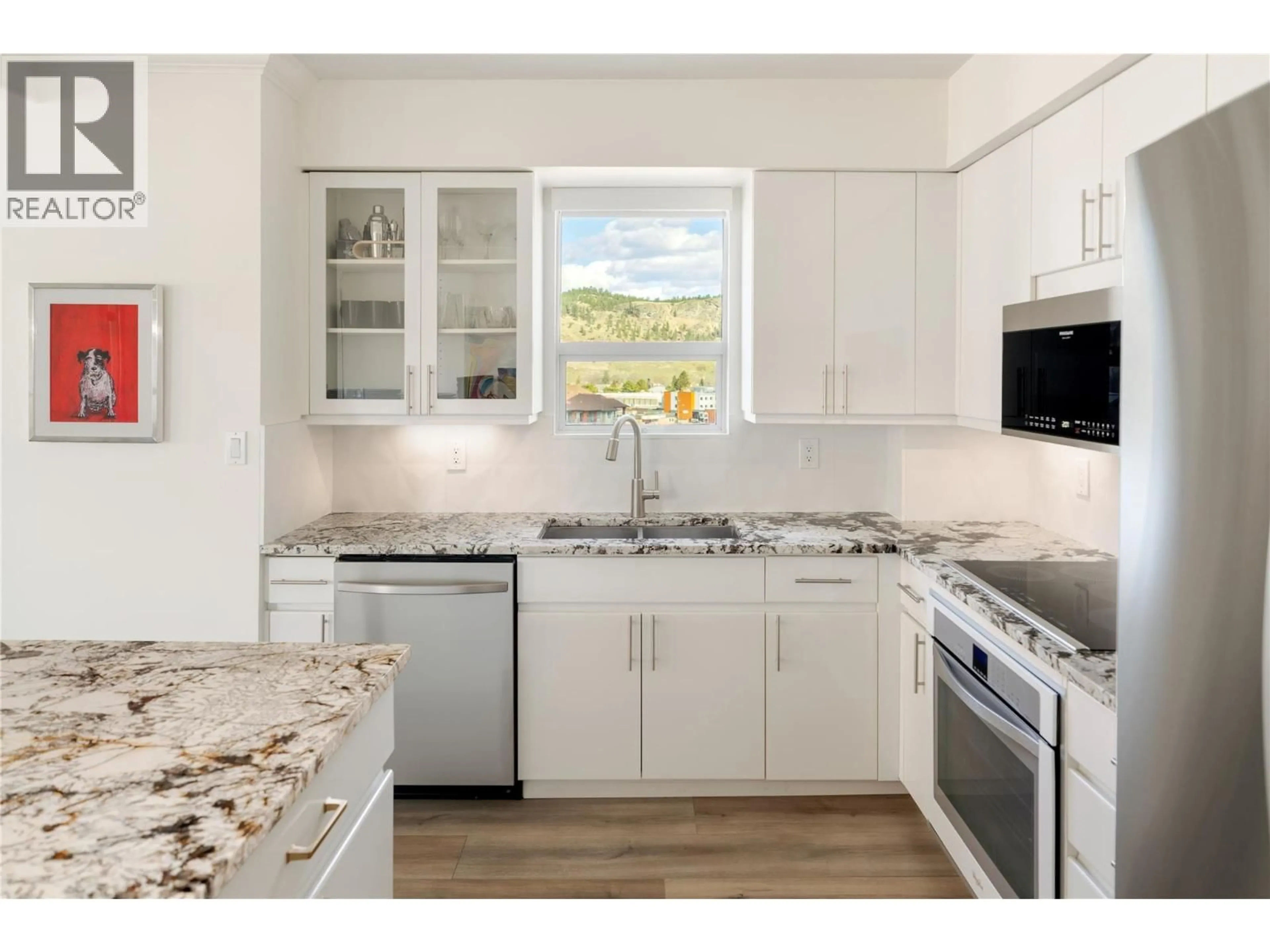Open concept kitchen, ceramic/tile floor for 801 - 1152 SUNSET DRIVE, Kelowna British Columbia V1Y9R7