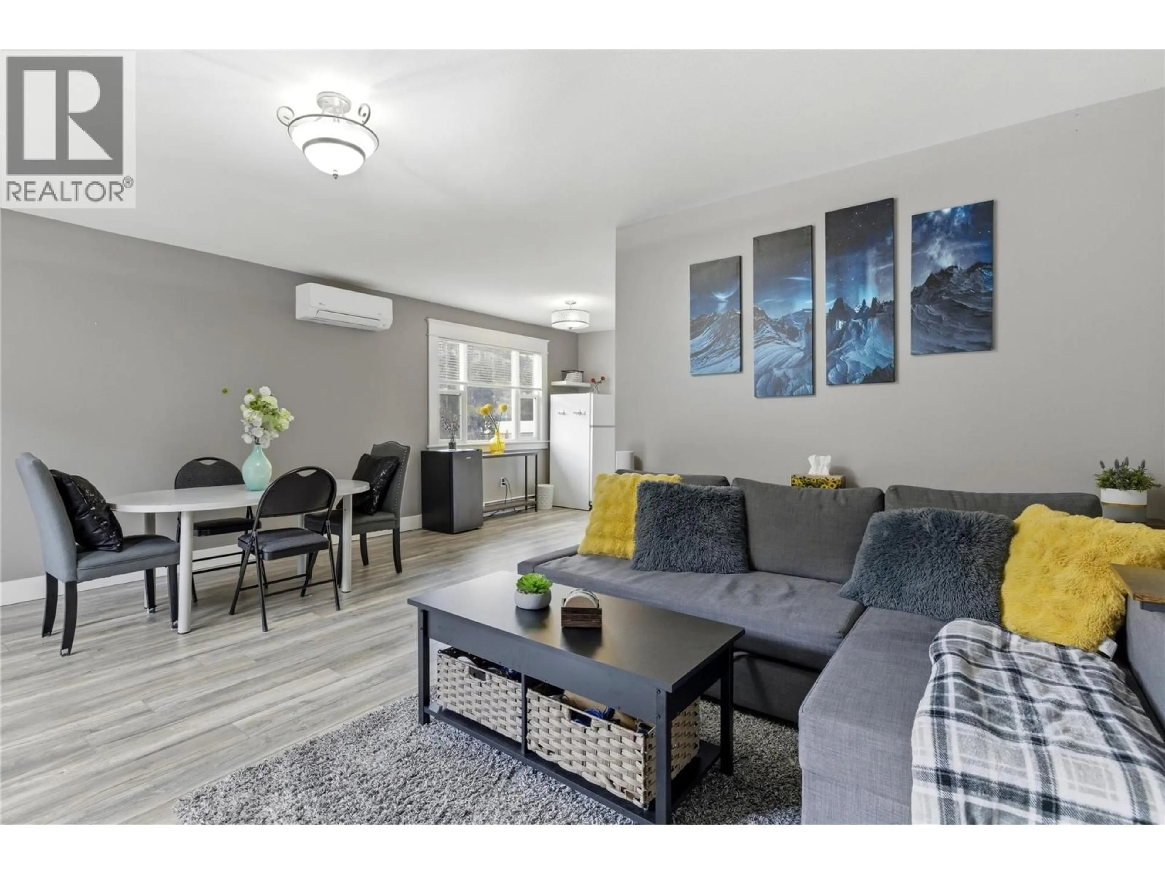 Living room with furniture, wood/laminate floor for 9 - 500 LESTER ROAD, Kelowna British Columbia V1X6E2