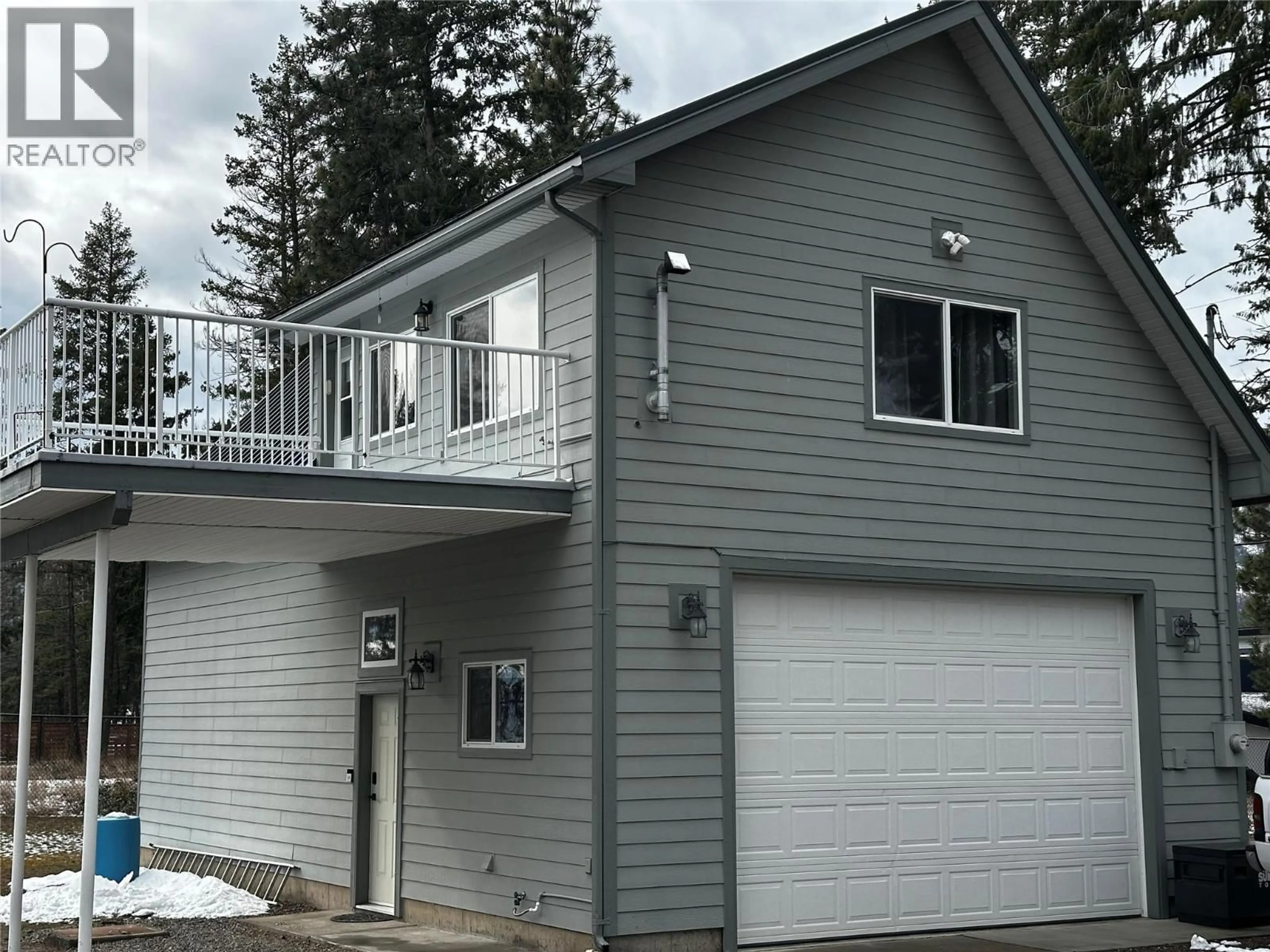 Home with vinyl exterior material, street for 7245 DUNWATERS ROAD, Kelowna British Columbia V1Z3W4