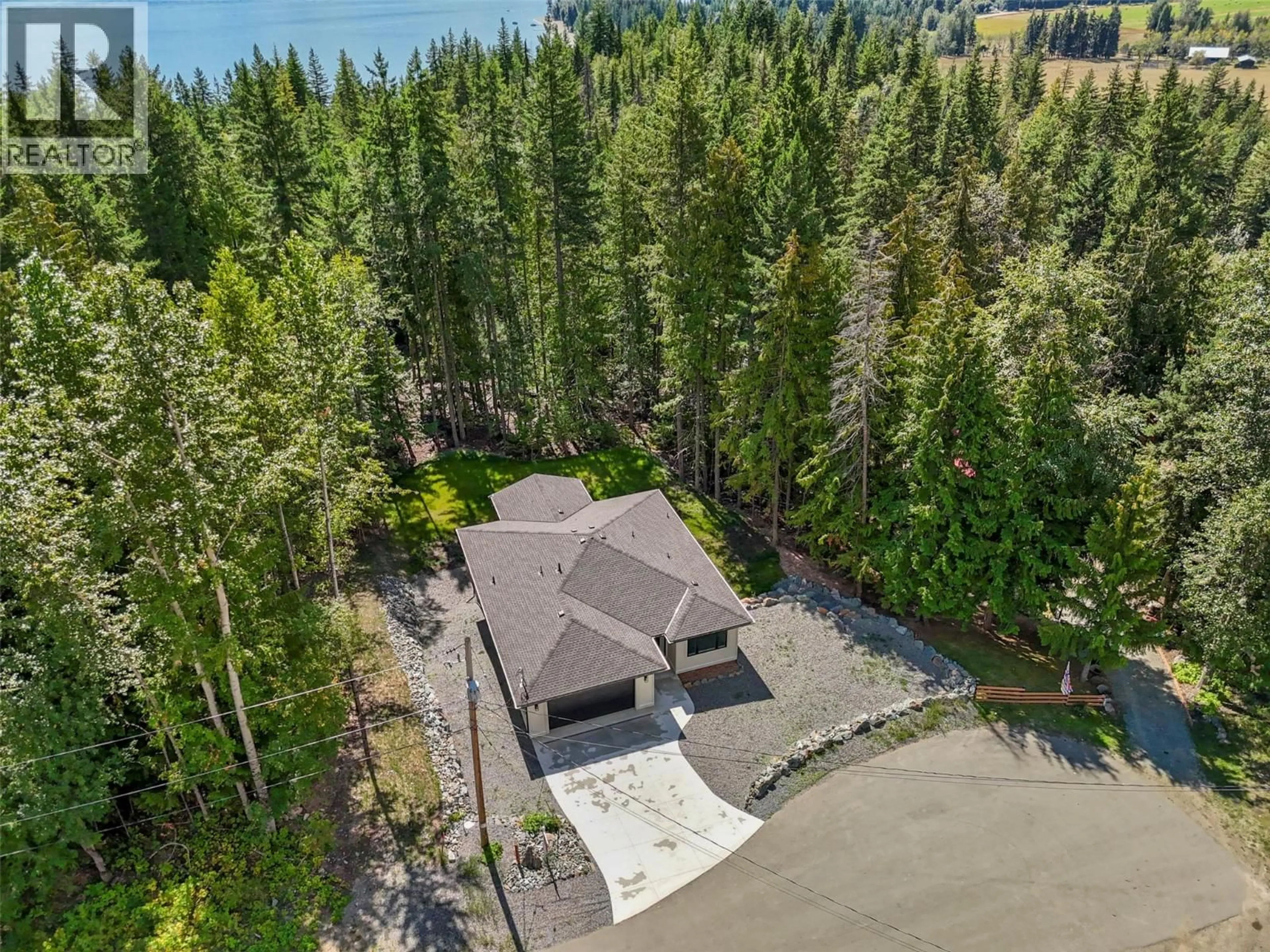 A pic from outside/outdoor area/front of a property/back of a property/a pic from drone, water/lake/river/ocean view for 7279 BIRCH CLOSE, Anglemont British Columbia V0E1M8