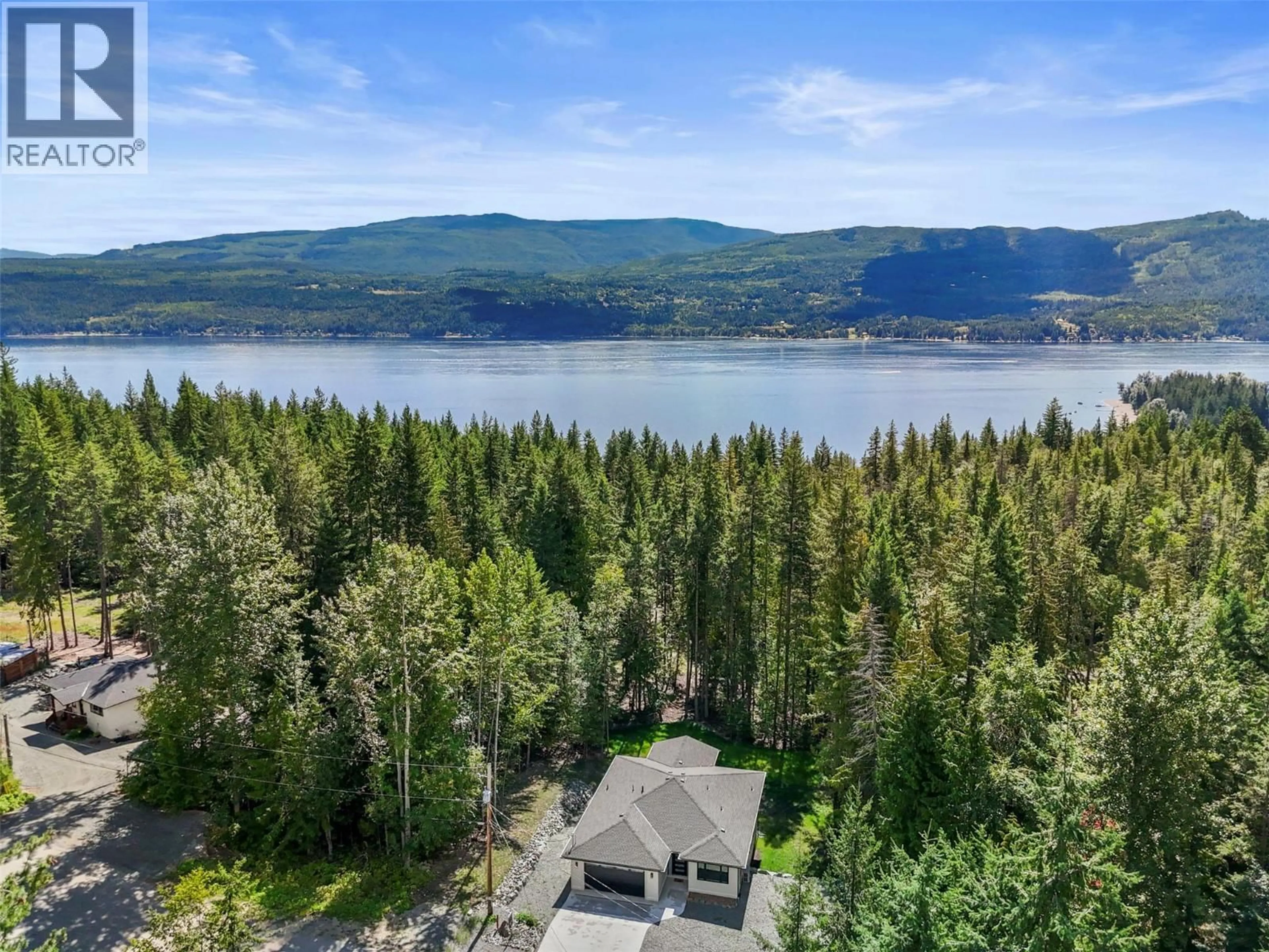 A pic from outside/outdoor area/front of a property/back of a property/a pic from drone, water/lake/river/ocean view for 7279 BIRCH CLOSE, Anglemont British Columbia V0E1M8