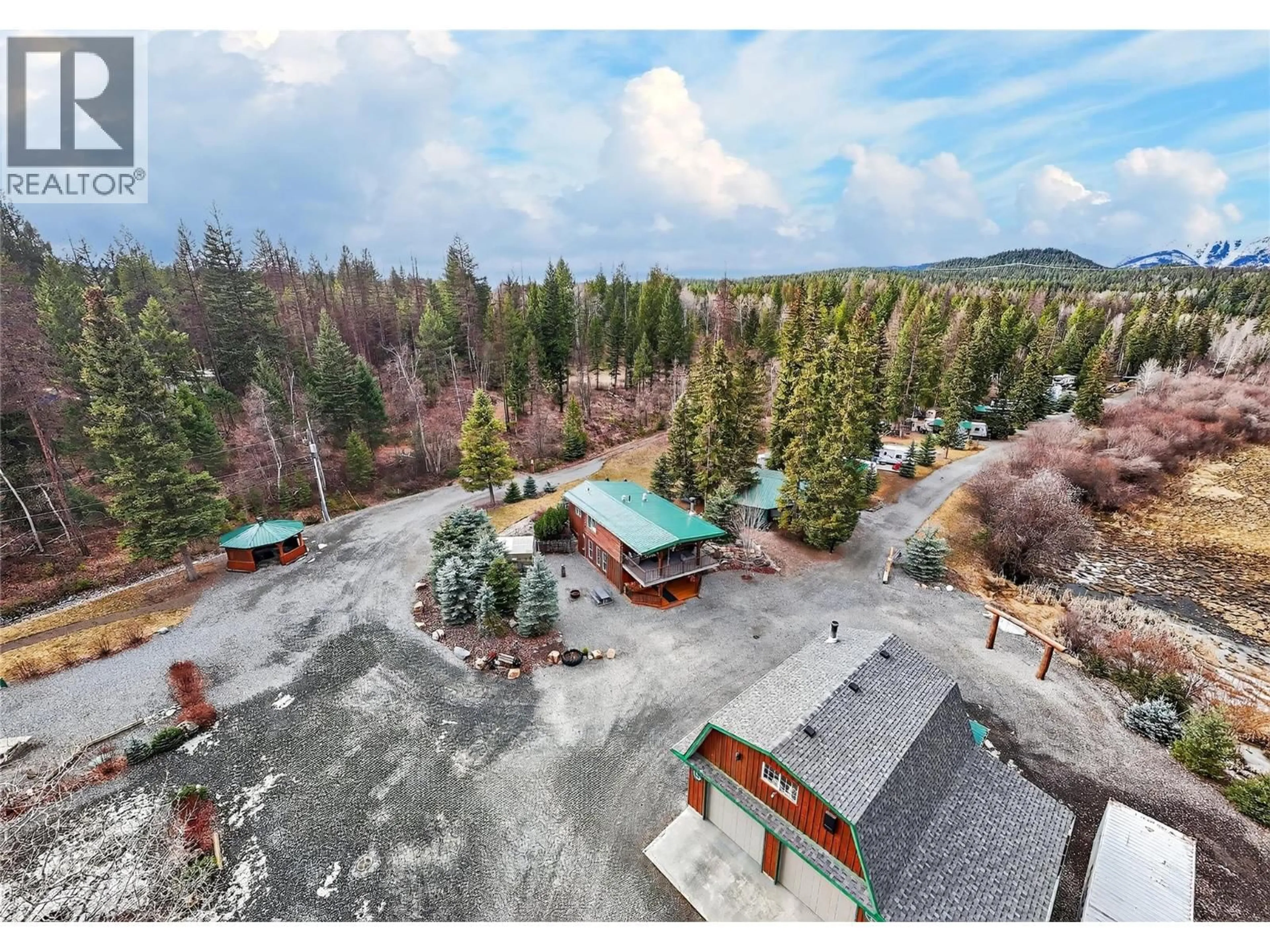 A pic from outside/outdoor area/front of a property/back of a property/a pic from drone, mountain view for 6206 TIE LAKE SHORE N ROAD, Jaffray British Columbia V0B1T0