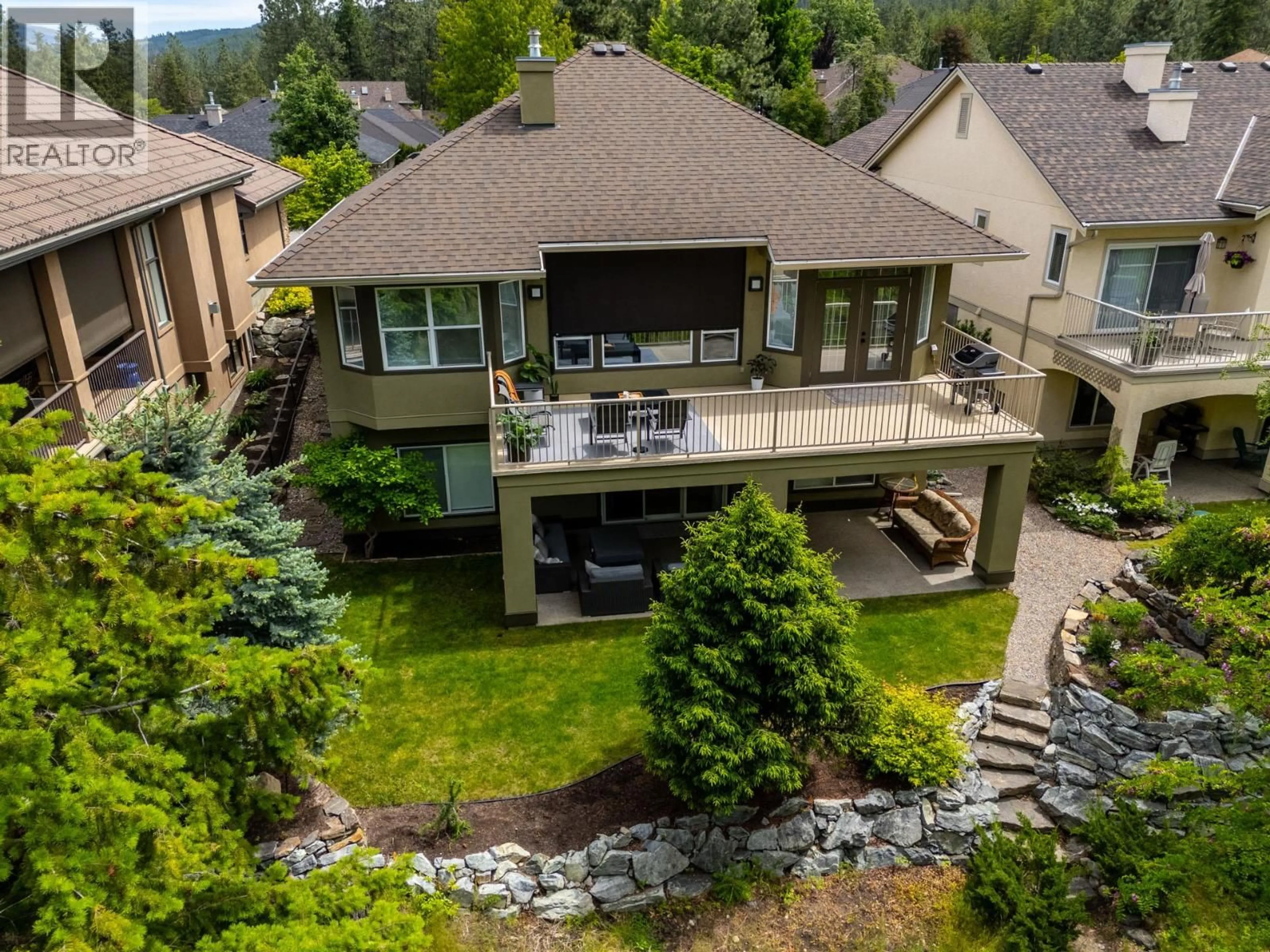 A pic from outside/outdoor area/front of a property/back of a property/a pic from drone, mountain view for 4158 GALLAGHERS FOREST SOUTH, Kelowna British Columbia V1W5E4