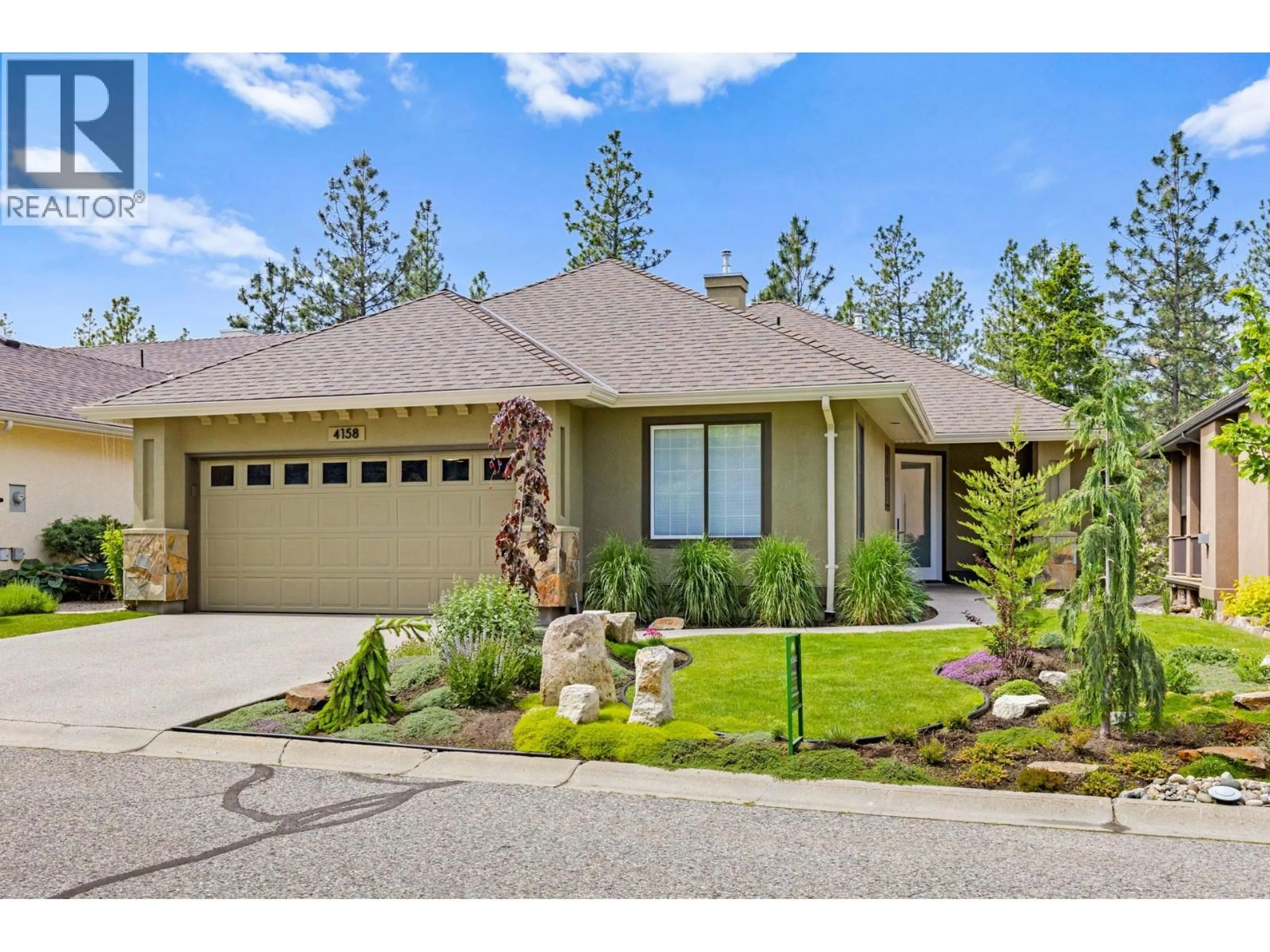 Home with vinyl exterior material, street for 4158 GALLAGHERS FOREST SOUTH, Kelowna British Columbia V1W5E4