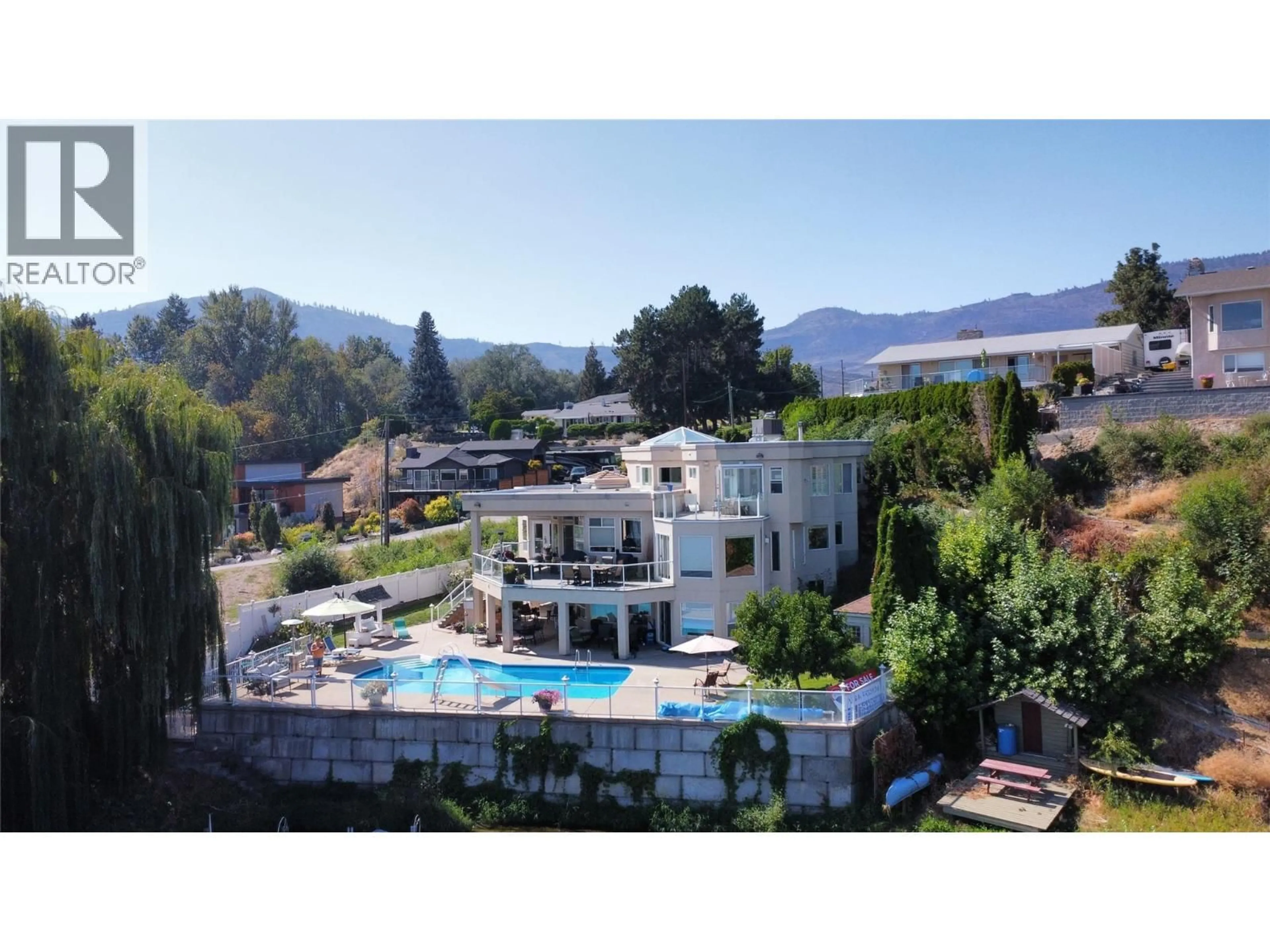 A pic from outside/outdoor area/front of a property/back of a property/a pic from drone, mountain view for 8330 22ND AVENUE, Osoyoos British Columbia V0H1V1