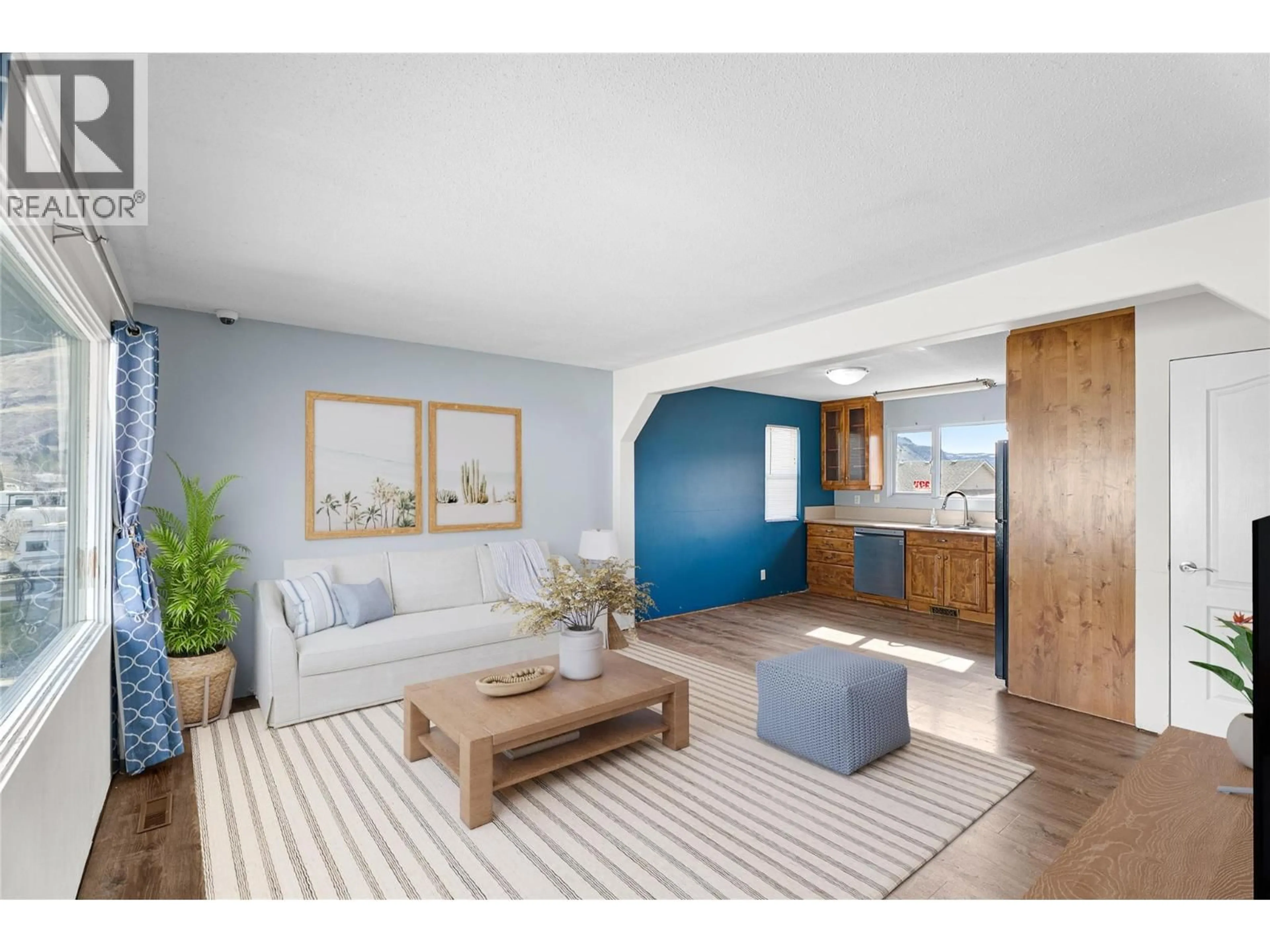 Living room with furniture, wood/laminate floor for 777 HUNTINGTON DRIVE, Kamloops British Columbia V2B6G3