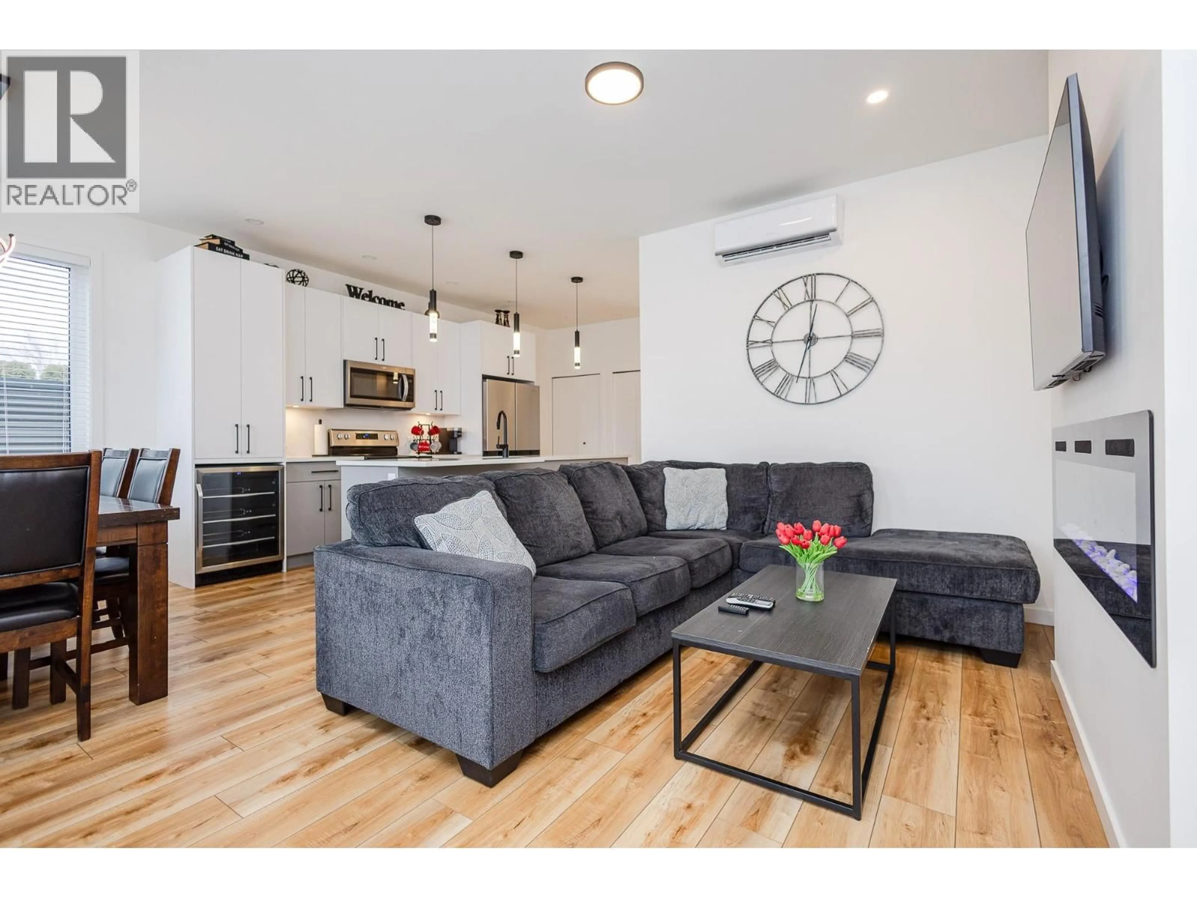 Living room with furniture, wood/laminate floor for 103 - 169 MAPLE STREET, Penticton British Columbia V2A5V4