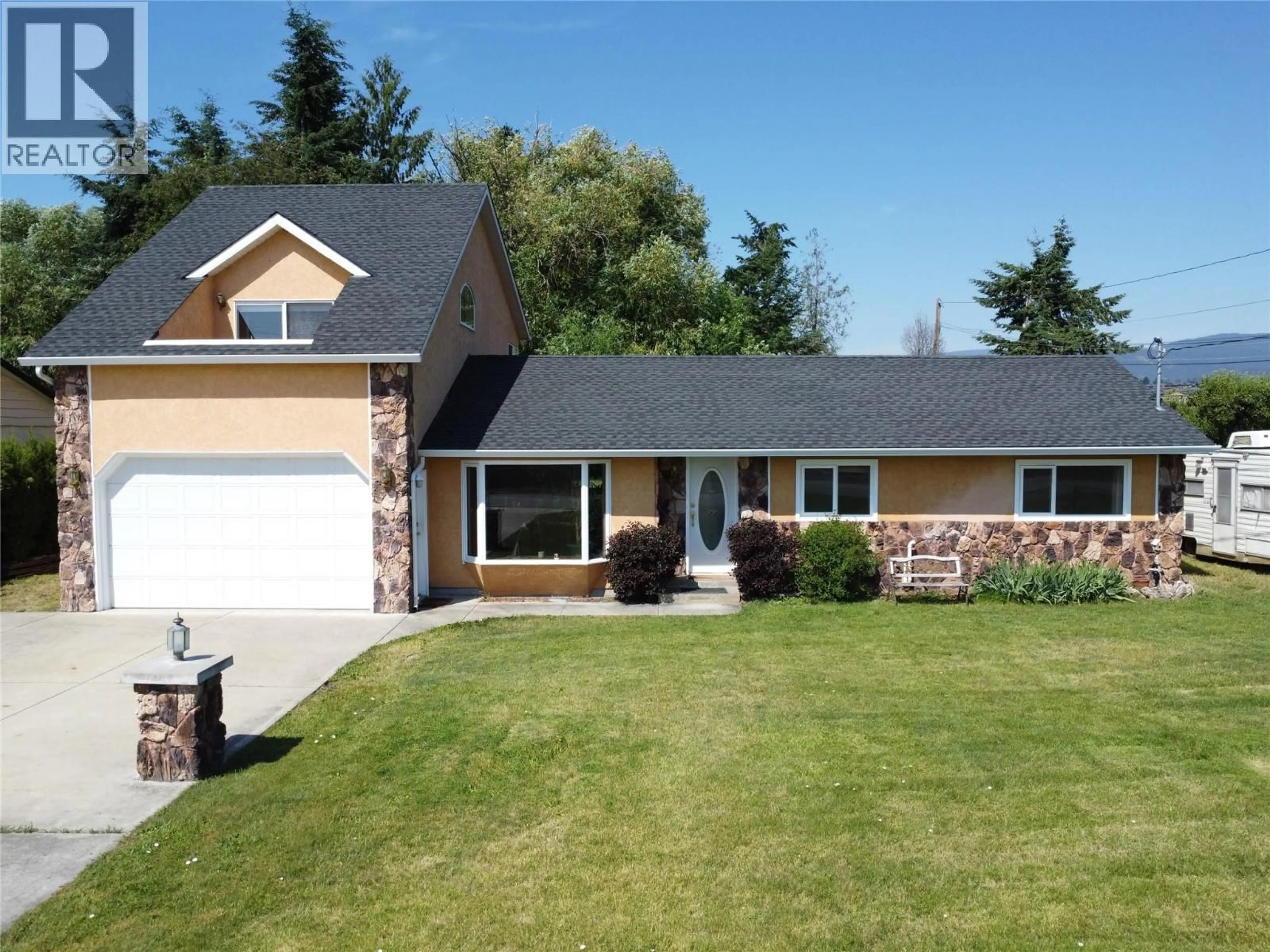 Home with vinyl exterior material, street for 3982 HITCHNER ROAD, West Kelowna British Columbia V4T2C9