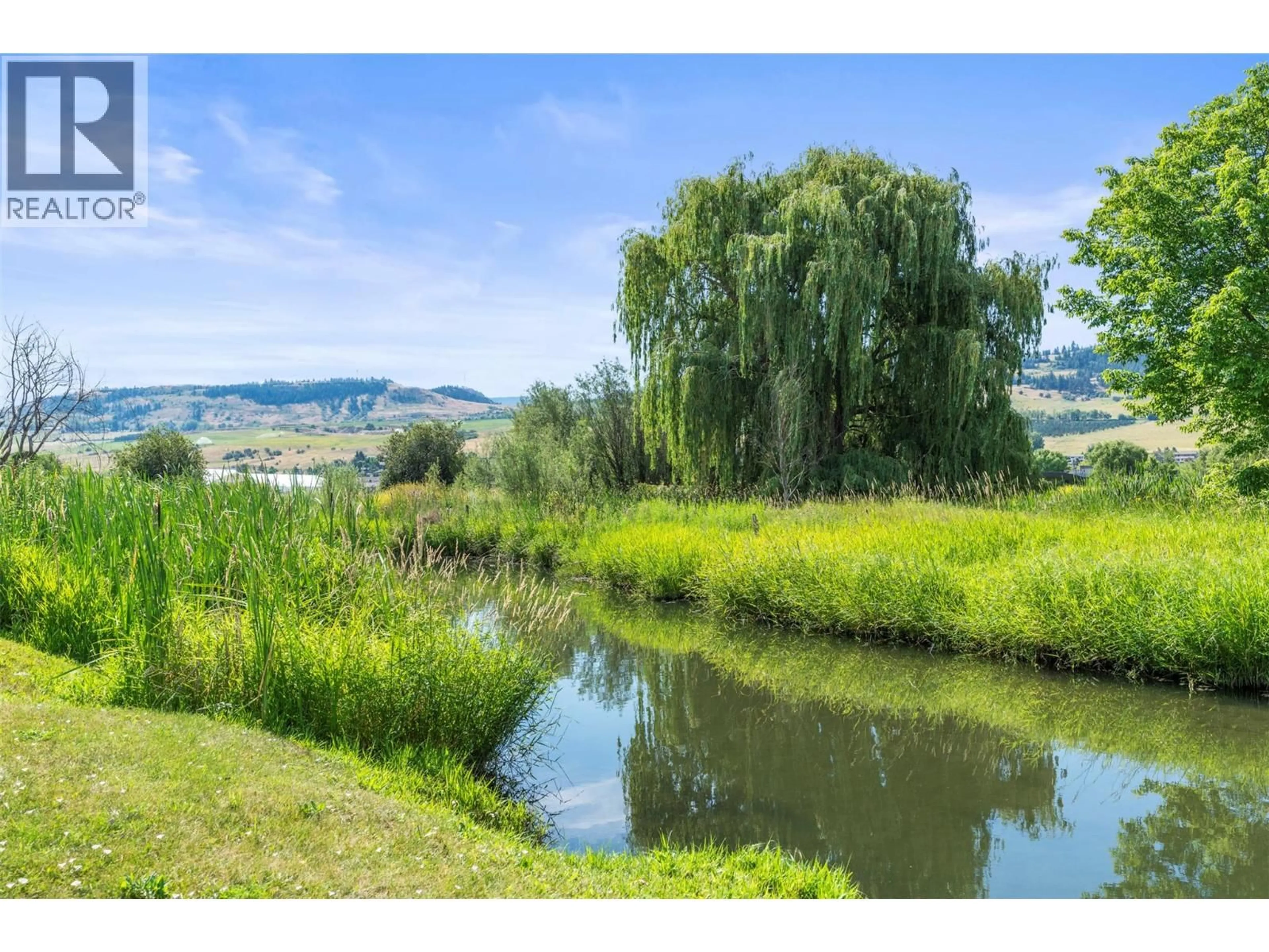 A pic from outside/outdoor area/front of a property/back of a property/a pic from drone, water/lake/river/ocean view for 101 - 2727 LAKESHORE ROAD, Vernon British Columbia V1H1X5