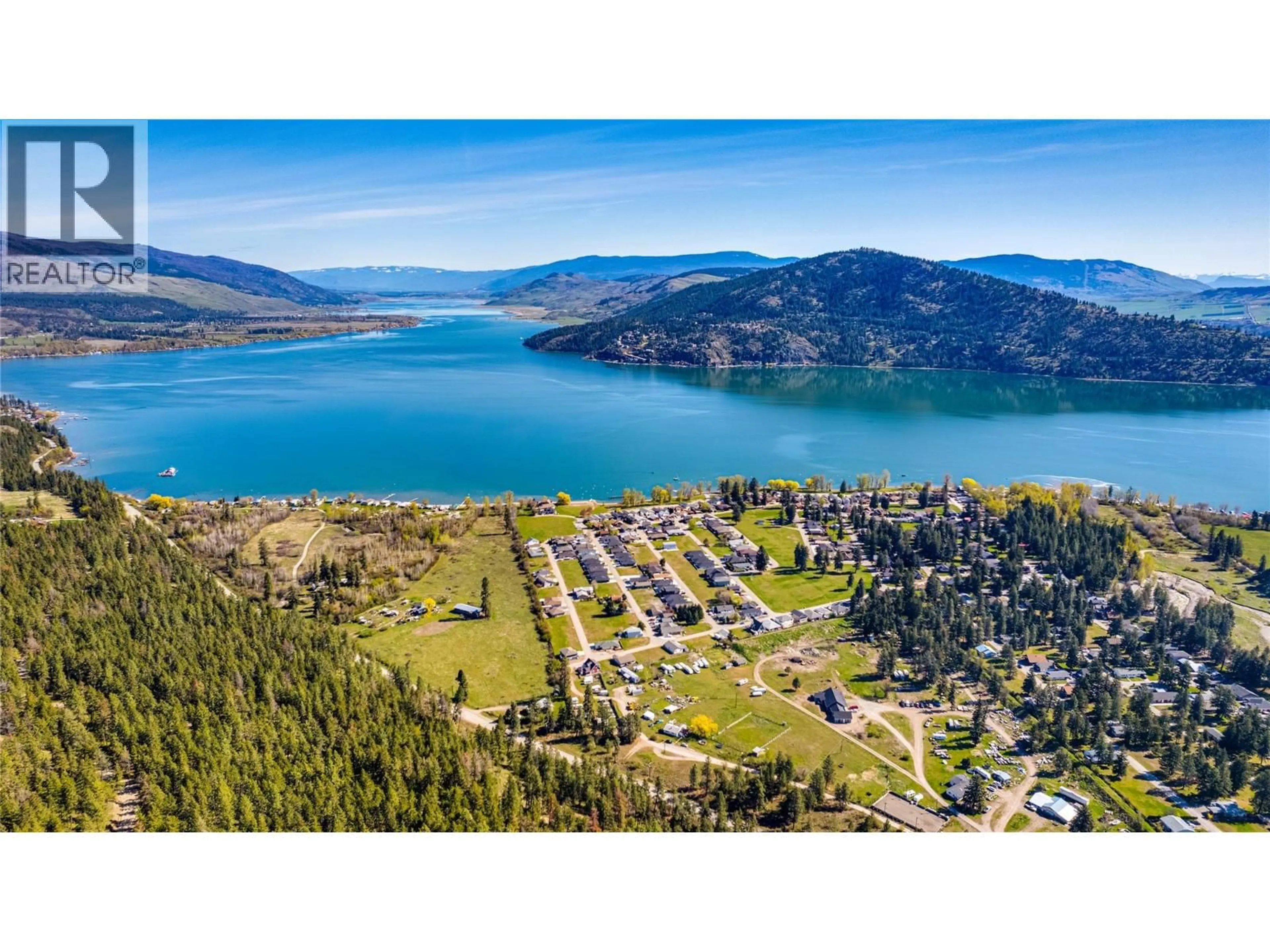 A pic from outside/outdoor area/front of a property/back of a property/a pic from drone, water/lake/river/ocean view for 129 DEER STREET, Vernon British Columbia V1H2A1