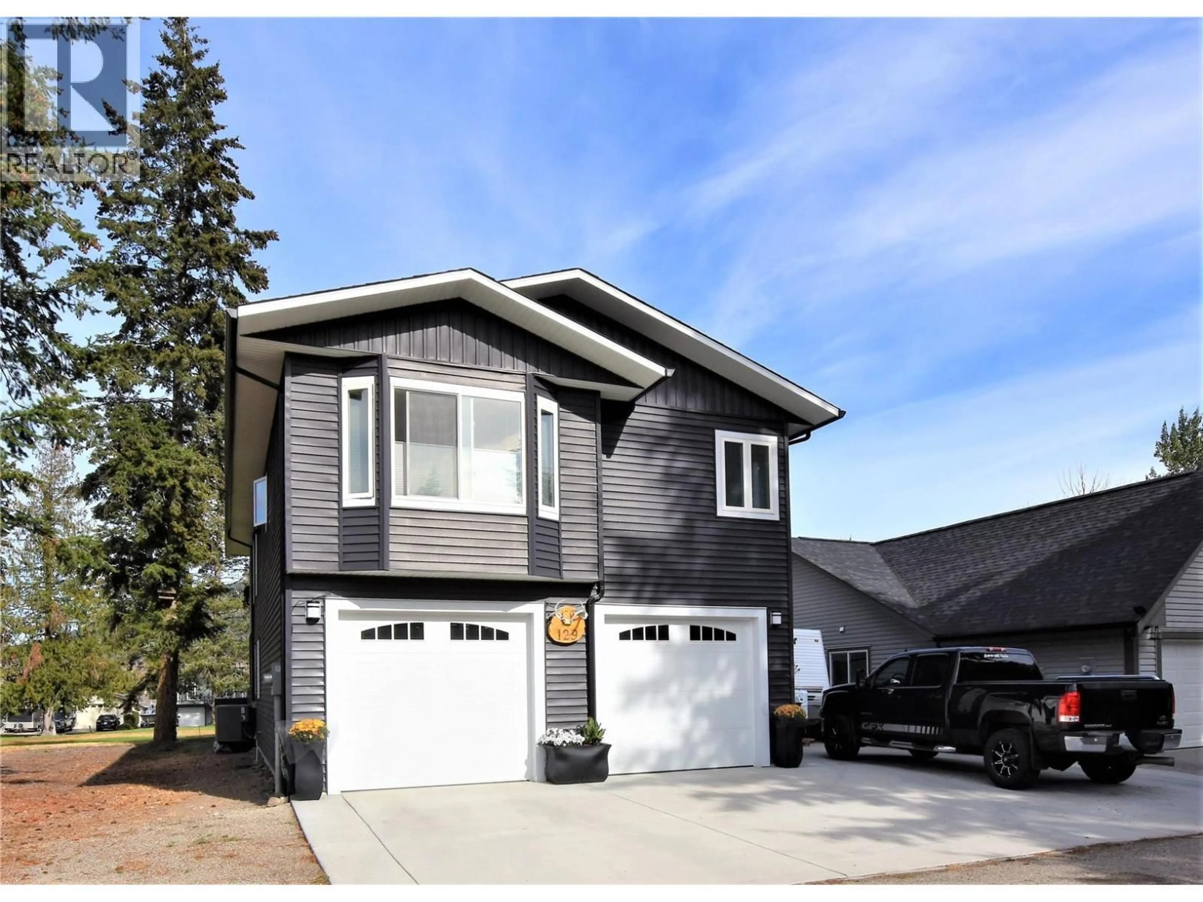 Home with vinyl exterior material, street for 129 DEER STREET, Vernon British Columbia V1H2A1