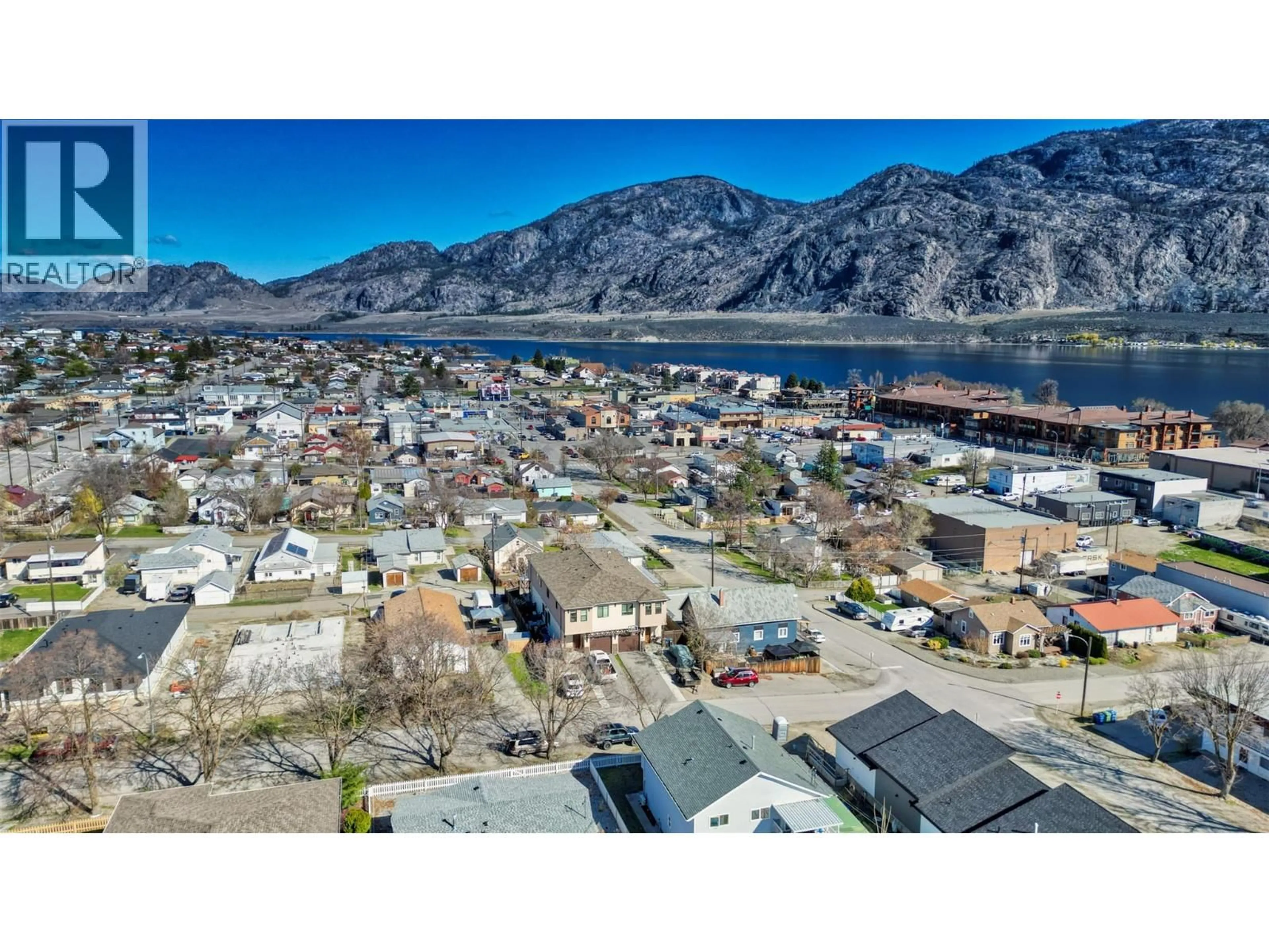A pic from outside/outdoor area/front of a property/back of a property/a pic from drone, mountain view for 102 - 8504 70TH AVENUE, Osoyoos British Columbia V0H1V1